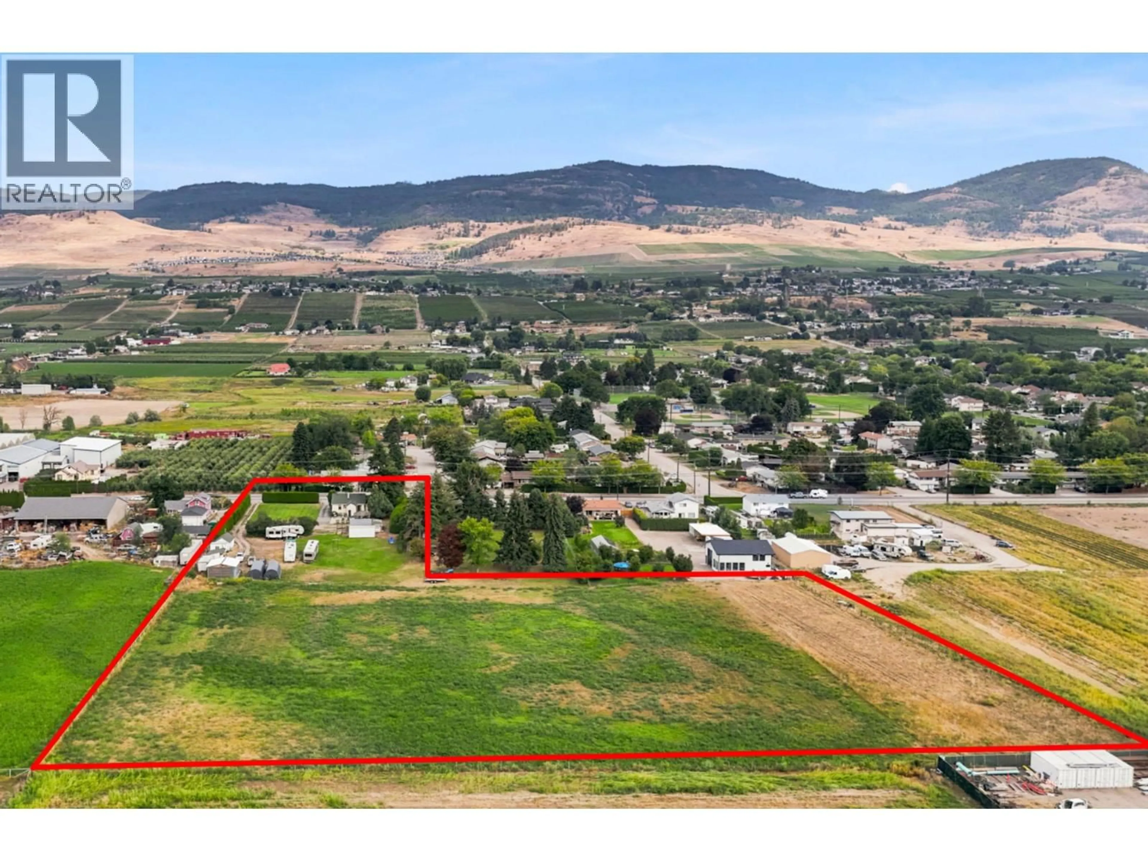 A pic from outside/outdoor area/front of a property/back of a property/a pic from drone, mountain view for 1666 RUTLAND ROAD, Kelowna British Columbia V1X4Z6