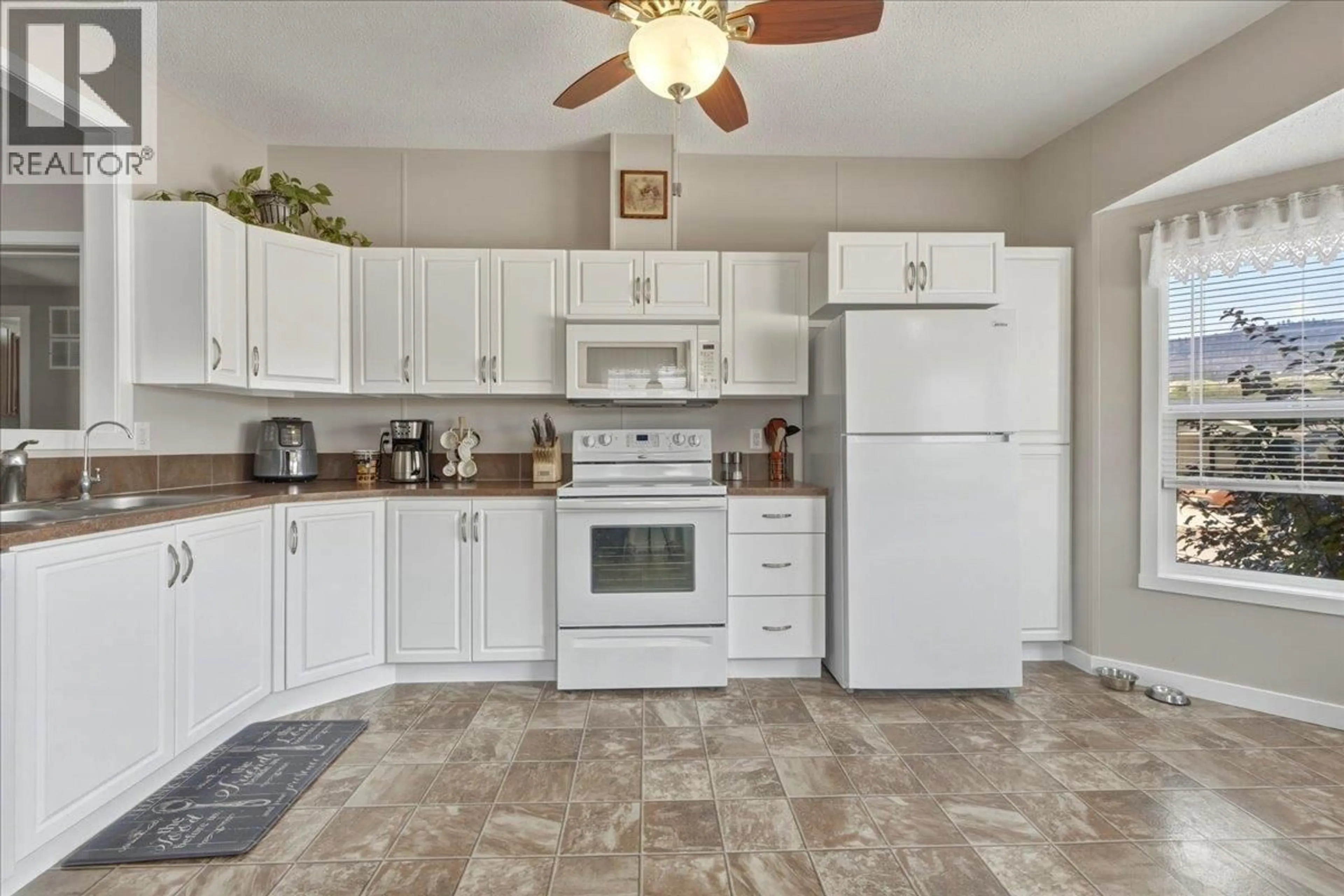 Standard kitchen, ceramic/tile floor for 77 - 12560 WESTSIDE ROAD, Vernon British Columbia V1H1S9