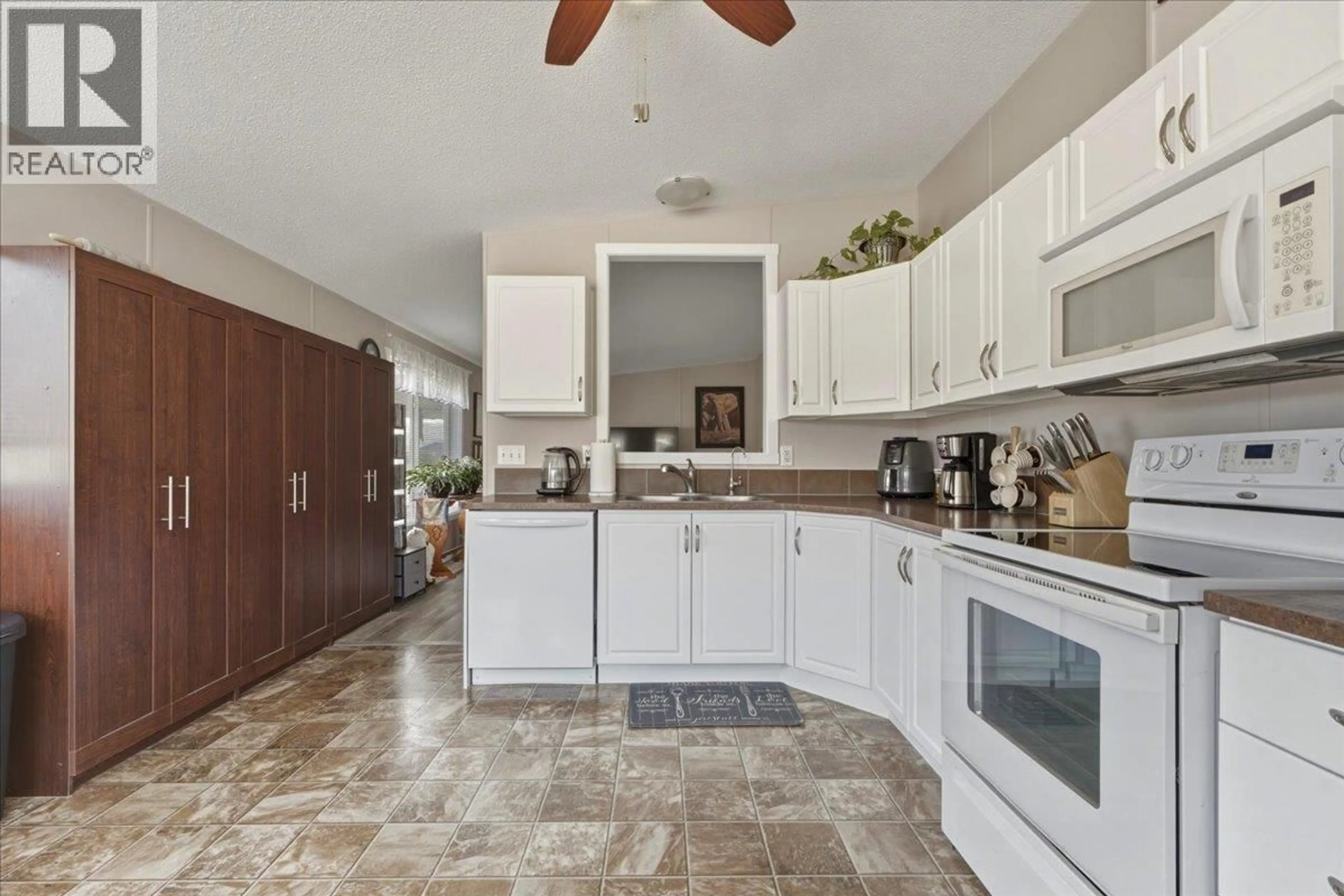 Open concept kitchen, ceramic/tile floor for 77 - 12560 WESTSIDE ROAD, Vernon British Columbia V1H1S9