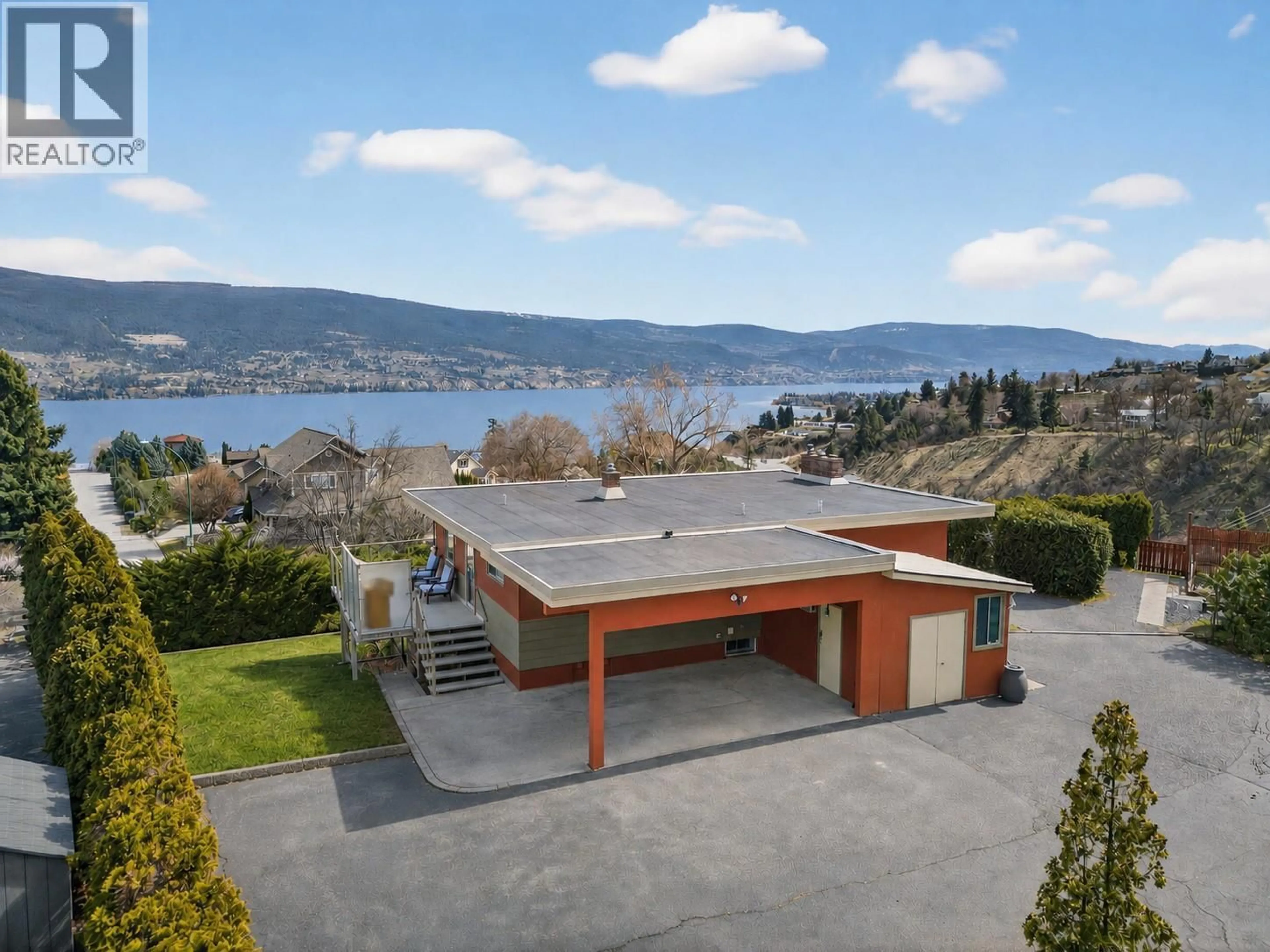 A pic from outside/outdoor area/front of a property/back of a property/a pic from drone, water/lake/river/ocean view for 13006 BRISTOW ROAD, Summerland British Columbia V0H1Z1