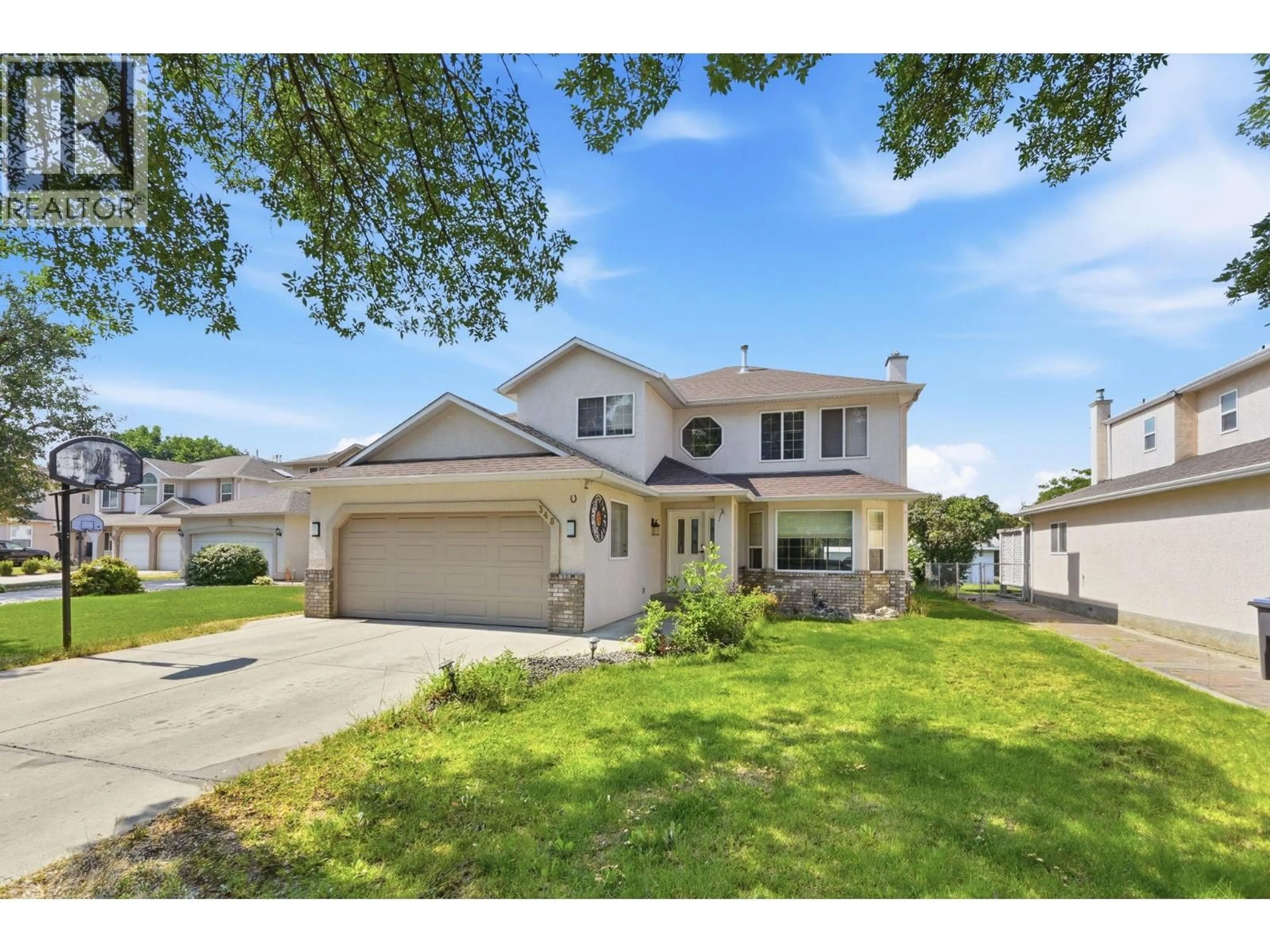 Home with vinyl exterior material, street for 348 PHIPPS CRESCENT, Kelowna British Columbia V1X7N8