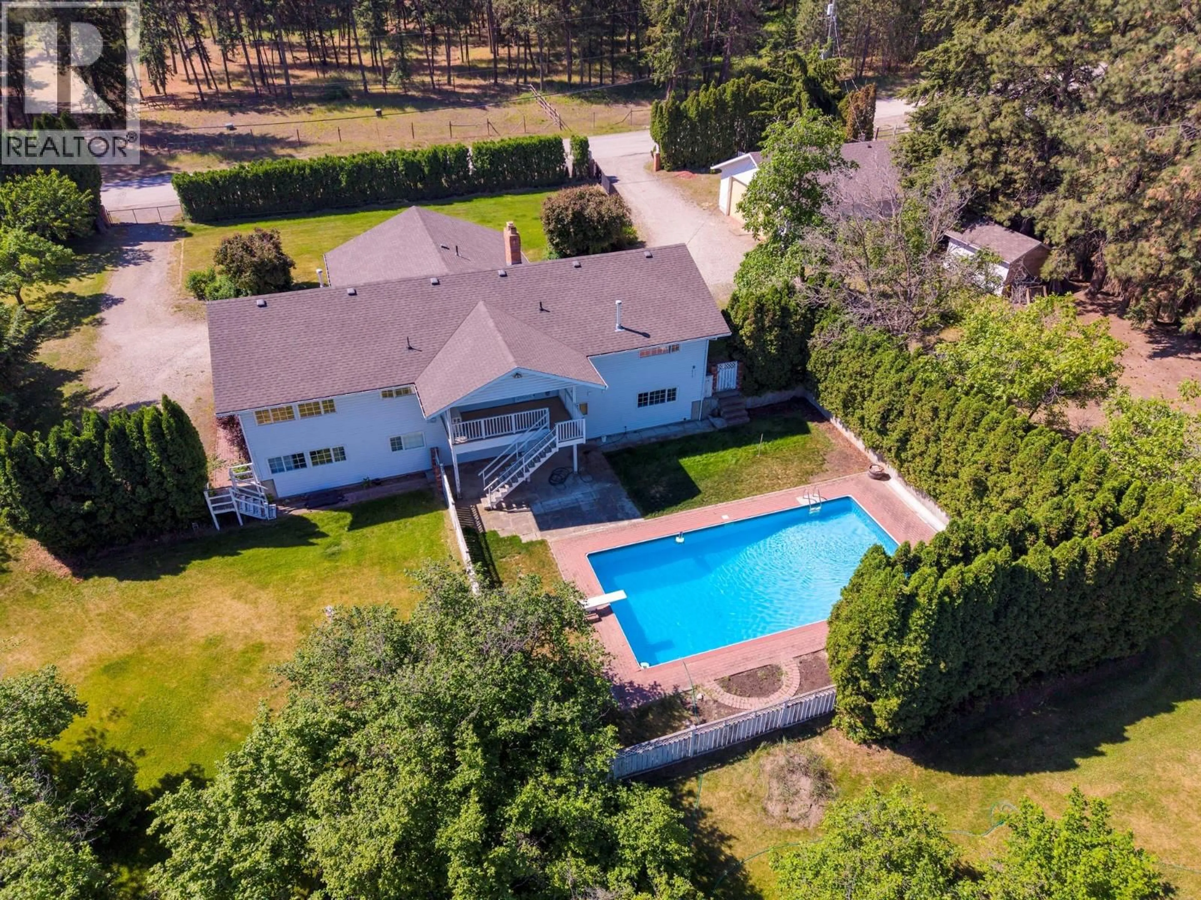A pic from outside/outdoor area/front of a property/back of a property/a pic from drone, water/lake/river/ocean view for 10151 CHASE ROAD, Lake Country British Columbia V4V1P3