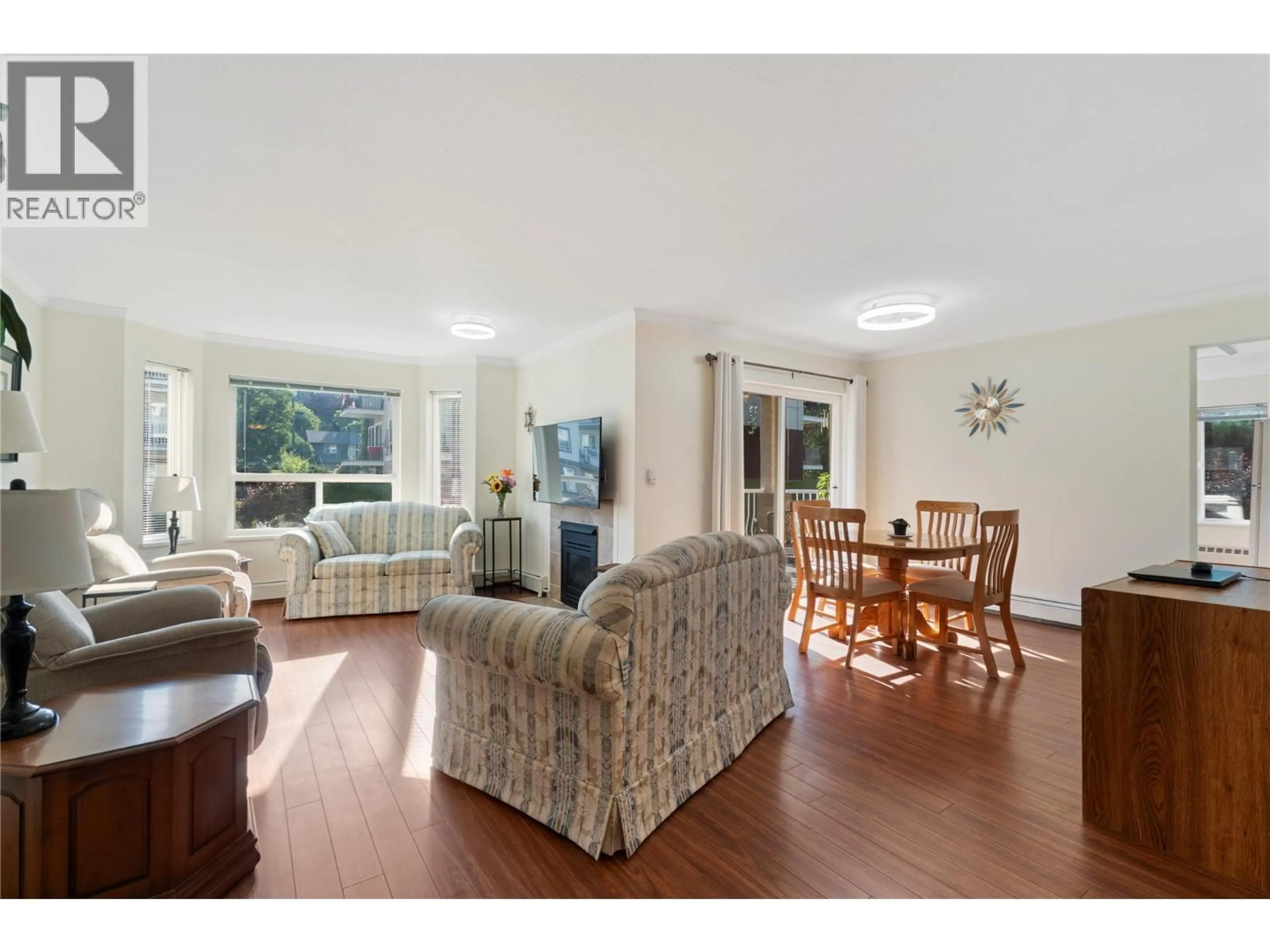 Living room with furniture, wood/laminate floor for 107 - 250 5 STREET SOUTHEAST, Salmon Arm British Columbia V1E1J8