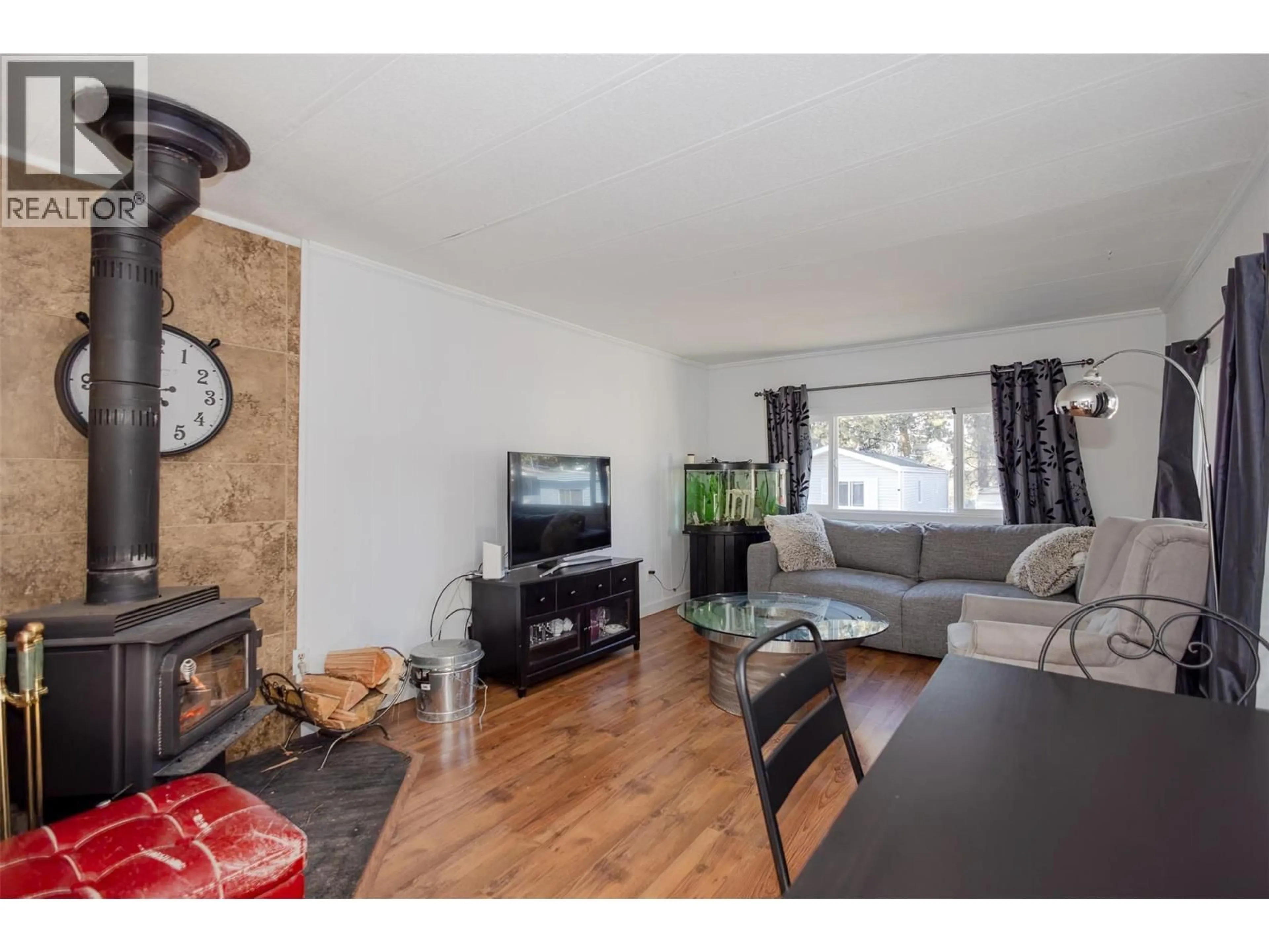 Living room with furniture, wood/laminate floor for 133 - 1999 HIGHWAY 97 OTHER, West Kelowna British Columbia V1Z1B2