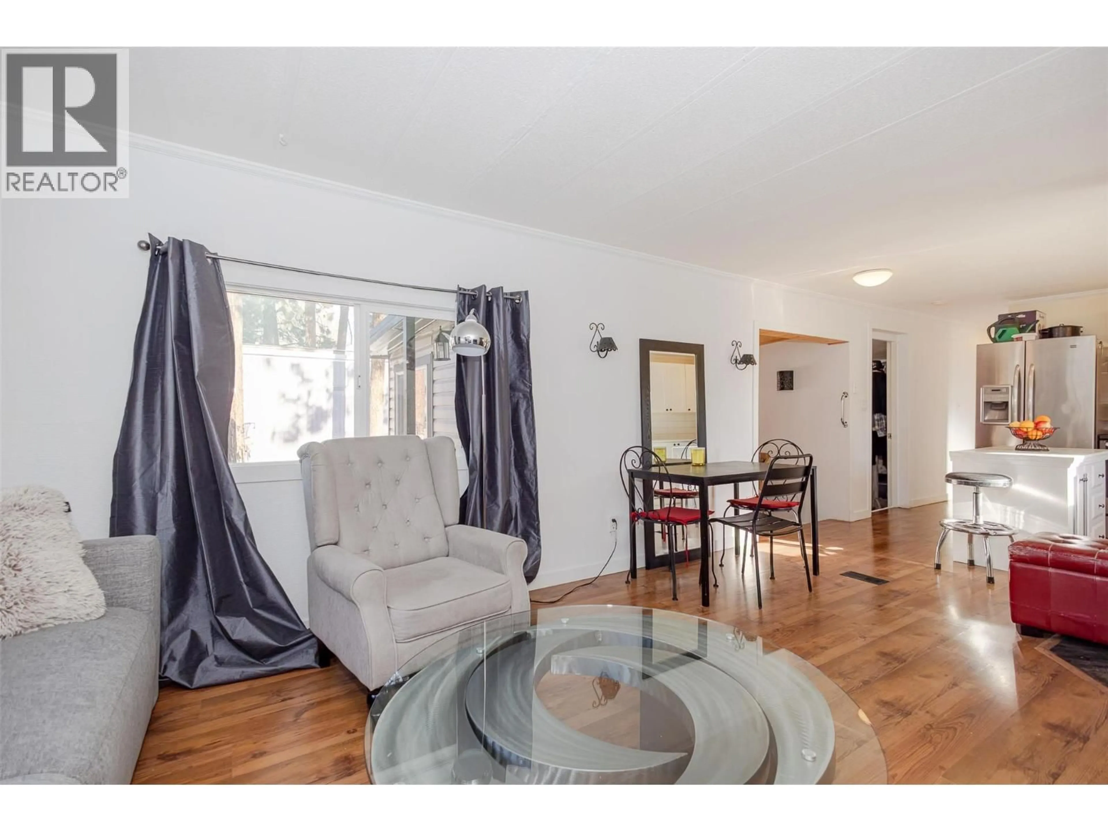Living room with furniture, wood/laminate floor for 133 - 1999 HIGHWAY 97 OTHER, West Kelowna British Columbia V1Z1B2