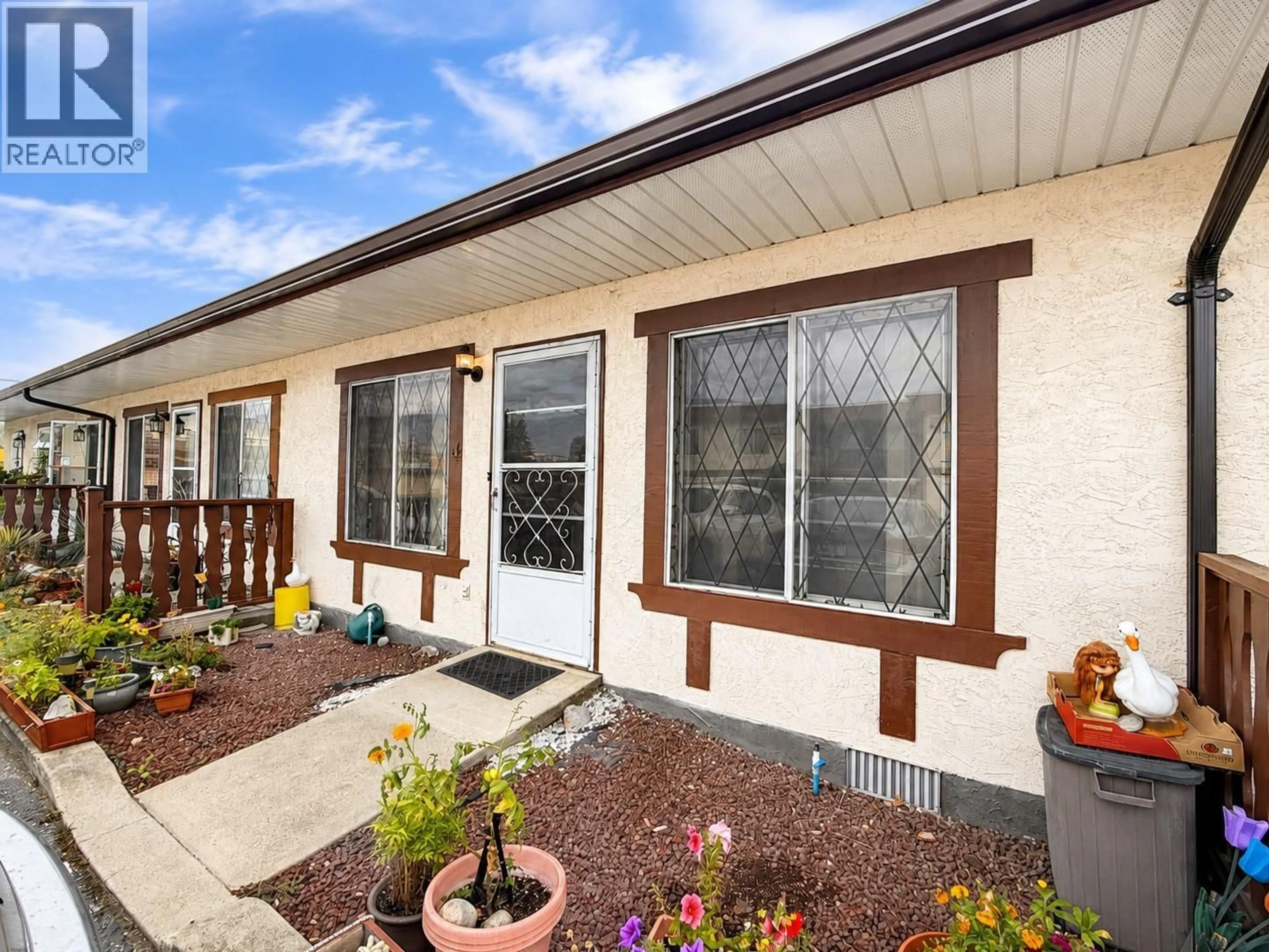 Home with vinyl exterior material, street for 4 - 5869 MAIN STREET, Oliver British Columbia V0H1T9