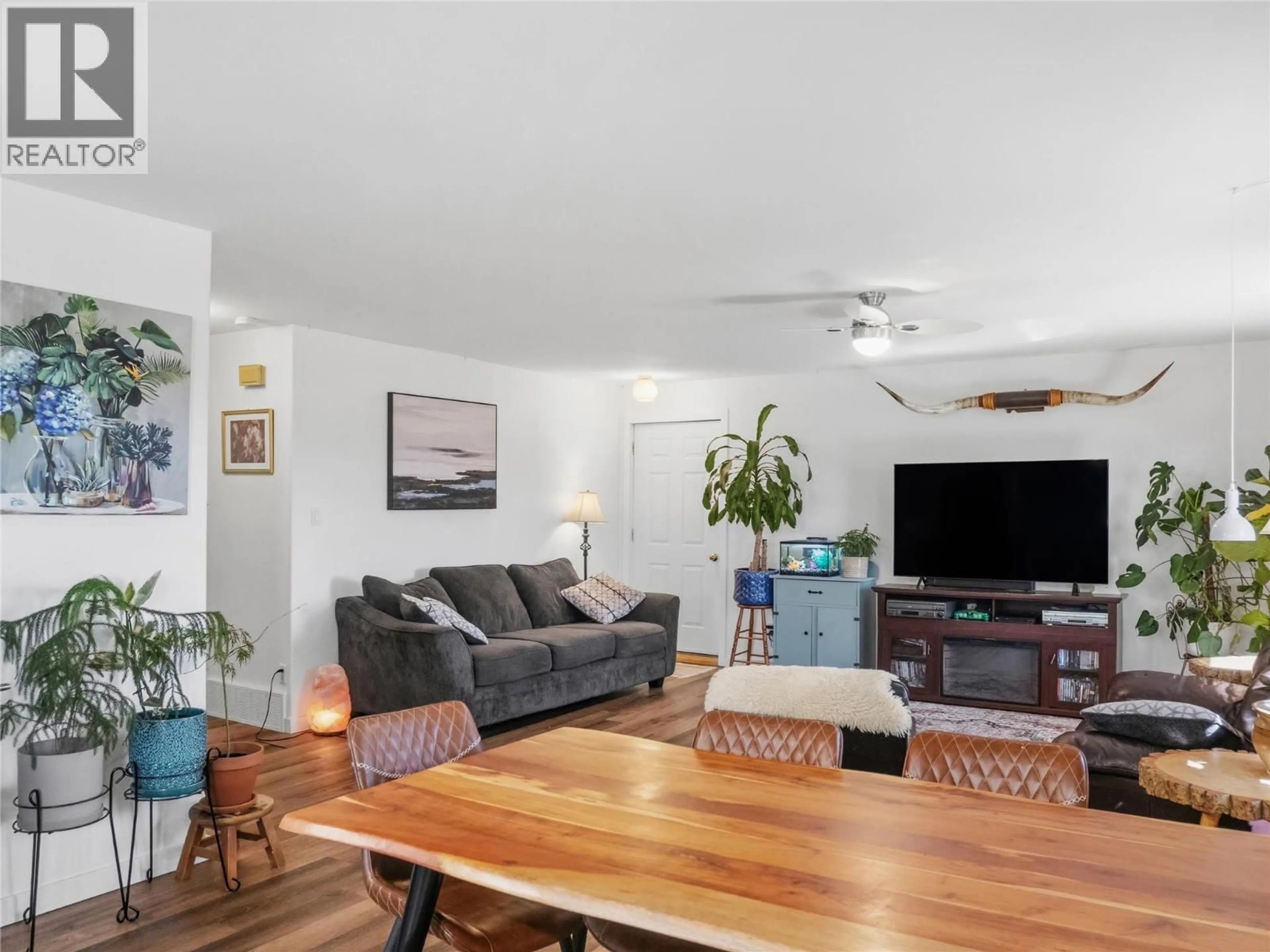 Living room with furniture, wood/laminate floor for 3766 216 ROAD, Dawson Creek British Columbia V1G0J3