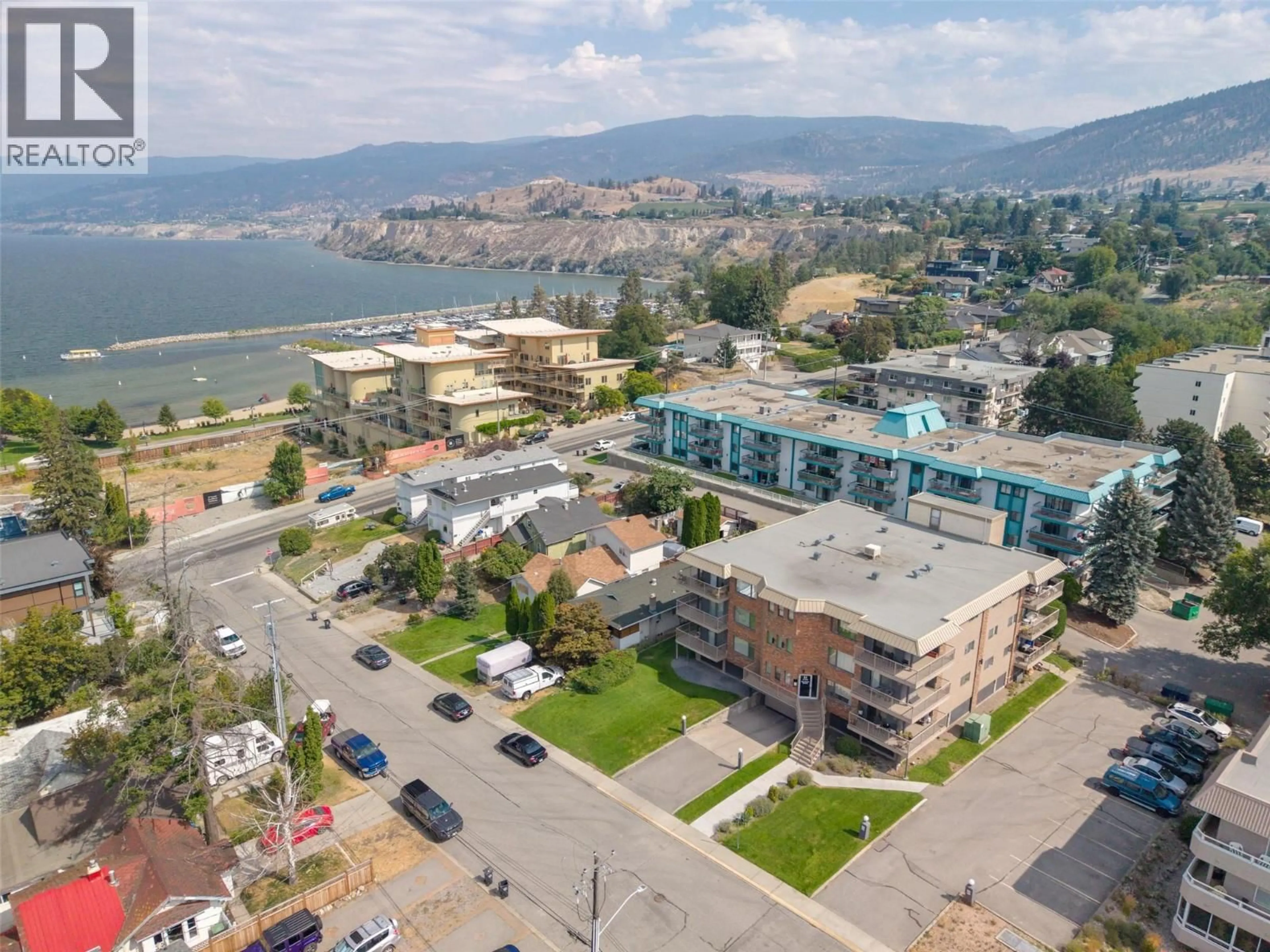 A pic from outside/outdoor area/front of a property/back of a property/a pic from drone, mountain view for 304 - 84 VAN HORNE STREET, Penticton British Columbia V2A4J8