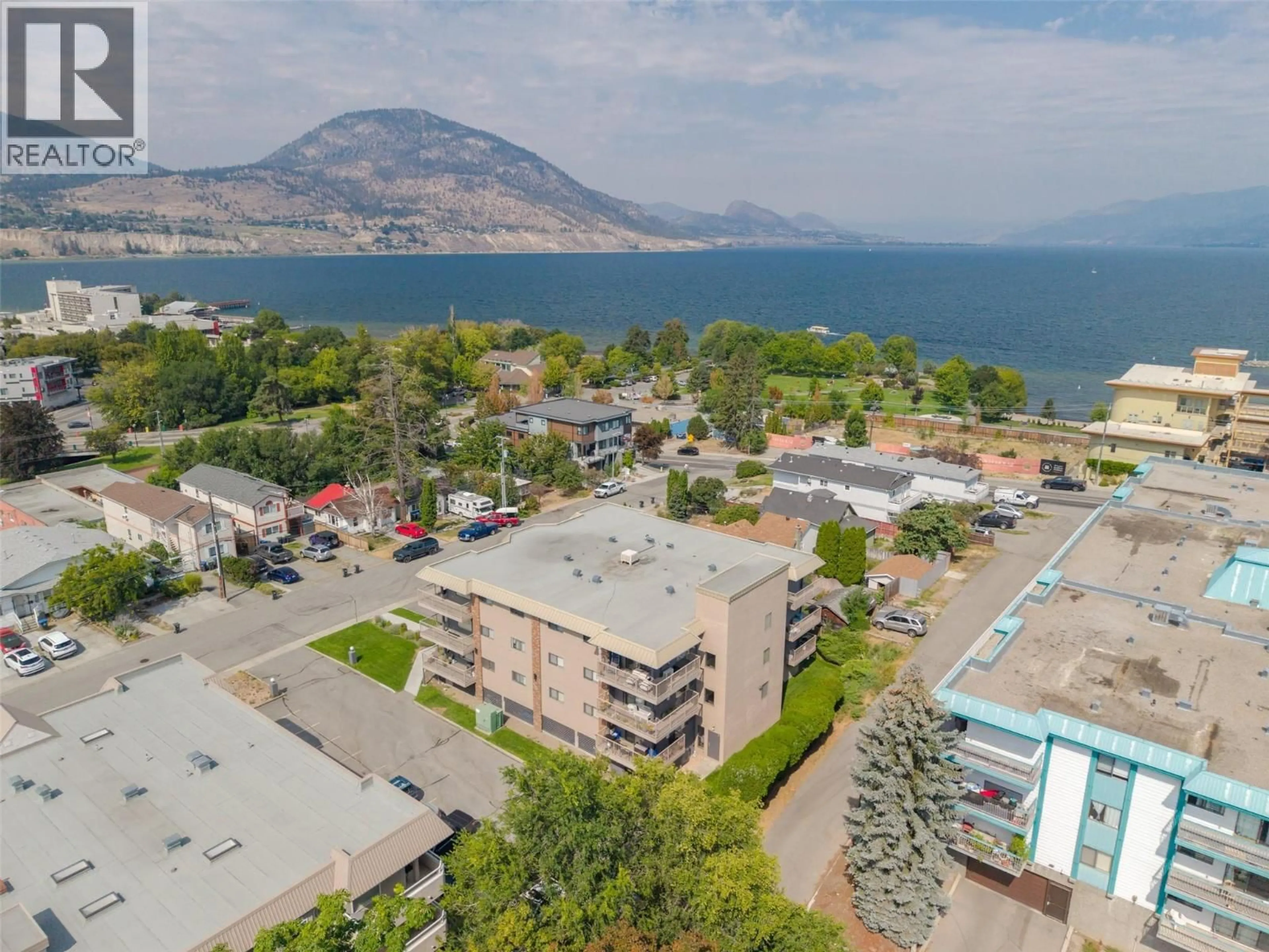 A pic from outside/outdoor area/front of a property/back of a property/a pic from drone, mountain view for 304 - 84 VAN HORNE STREET, Penticton British Columbia V2A4J8