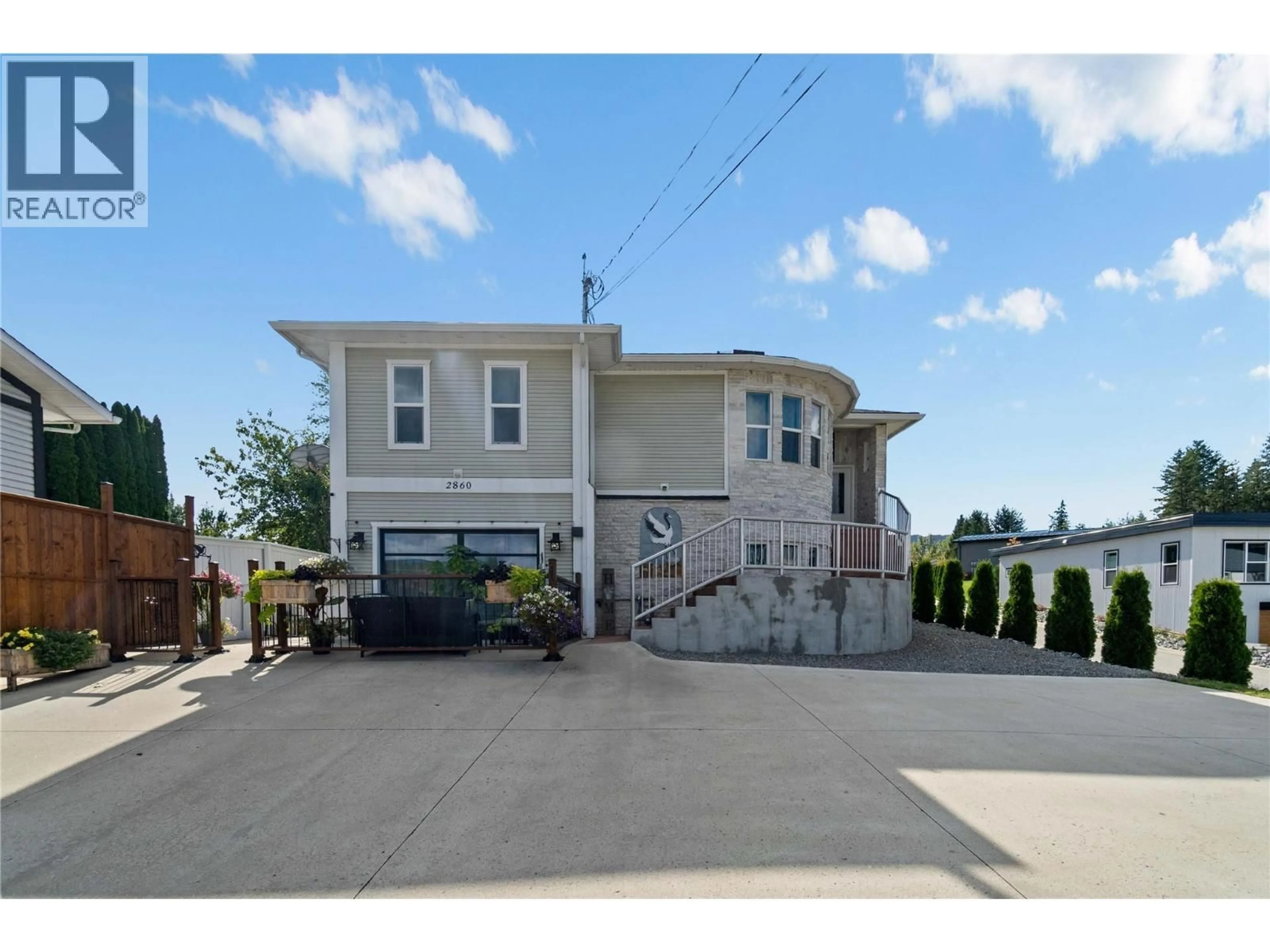 Home with vinyl exterior material, street for 2860 15 AVENUE NORTHEAST, Salmon Arm British Columbia V1E2B6