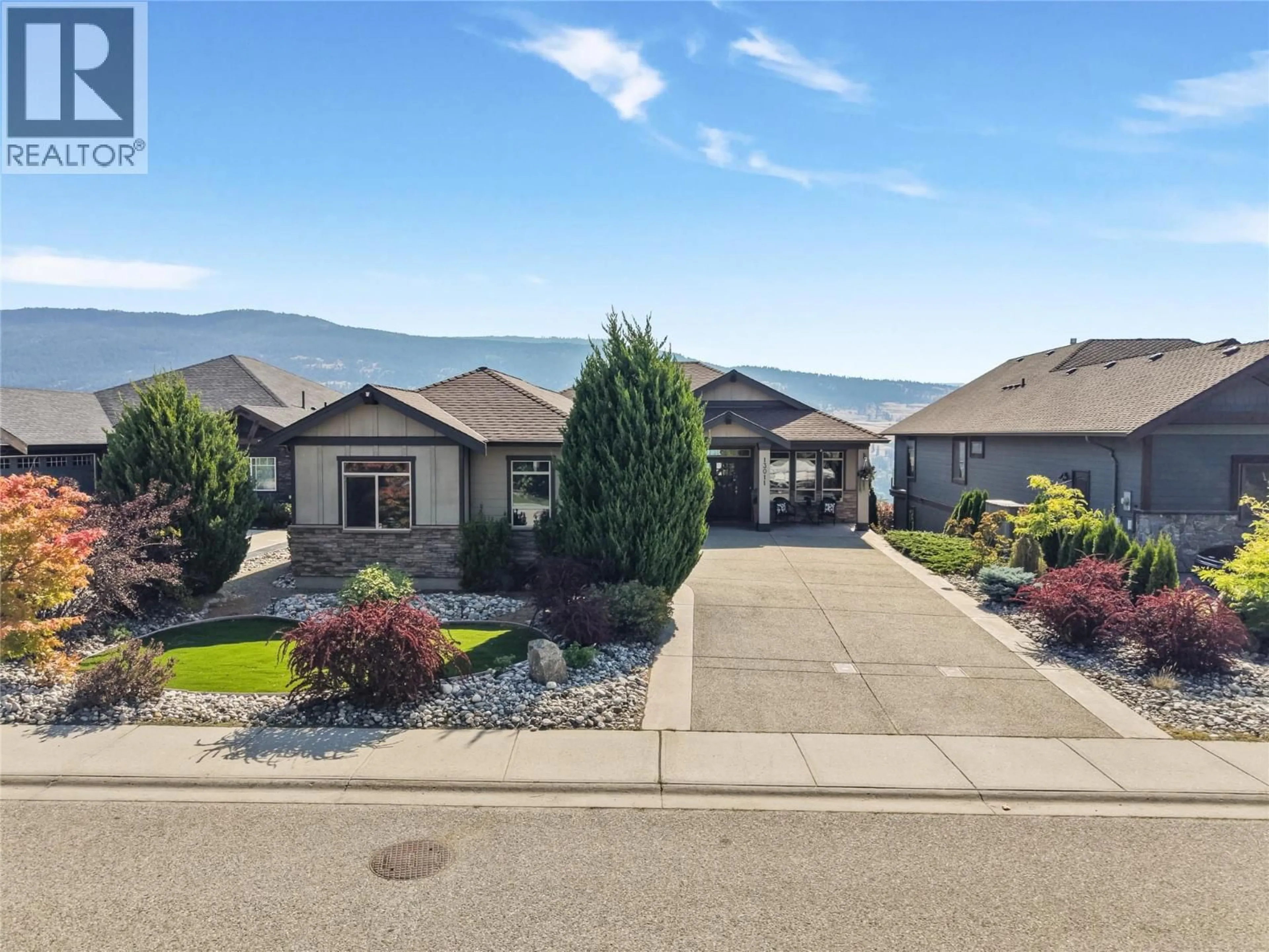 Home with vinyl exterior material, mountain view for 13011 EAST RIDGE DRIVE, Lake Country British Columbia V4V2P9