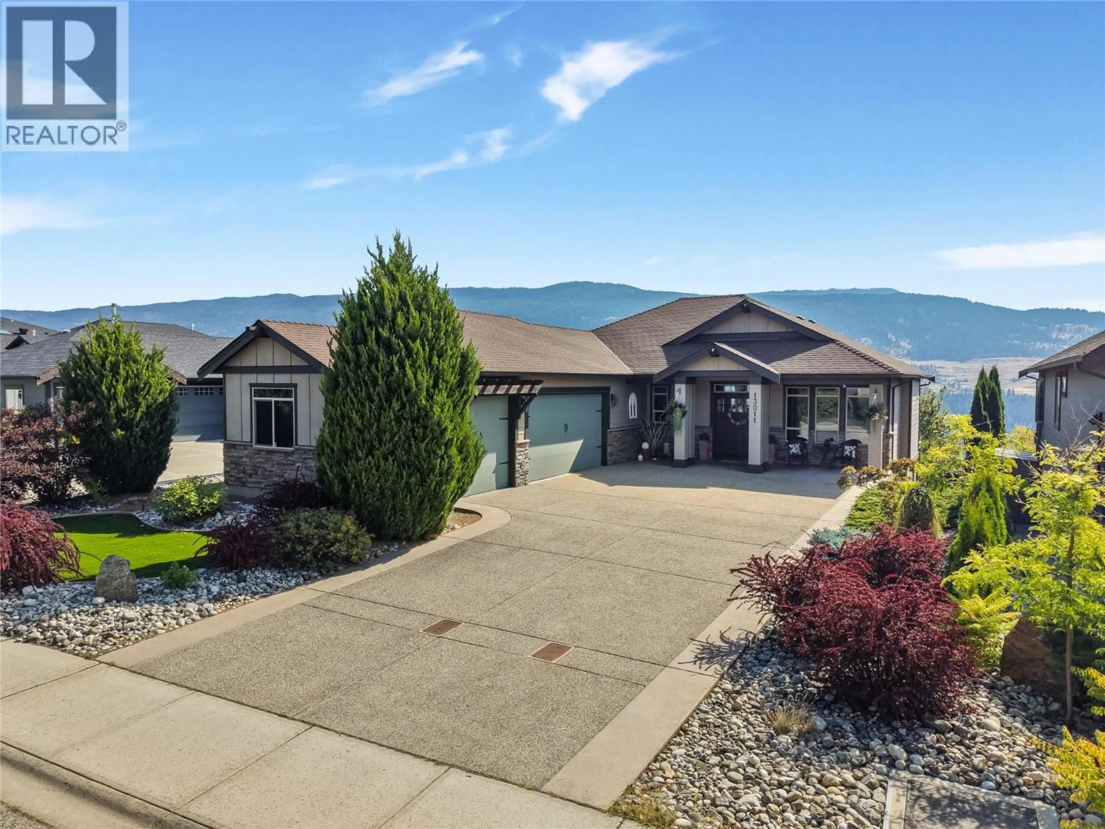 A pic from outside/outdoor area/front of a property/back of a property/a pic from drone, mountain view for 13011 EAST RIDGE DRIVE, Lake Country British Columbia V4V2P9