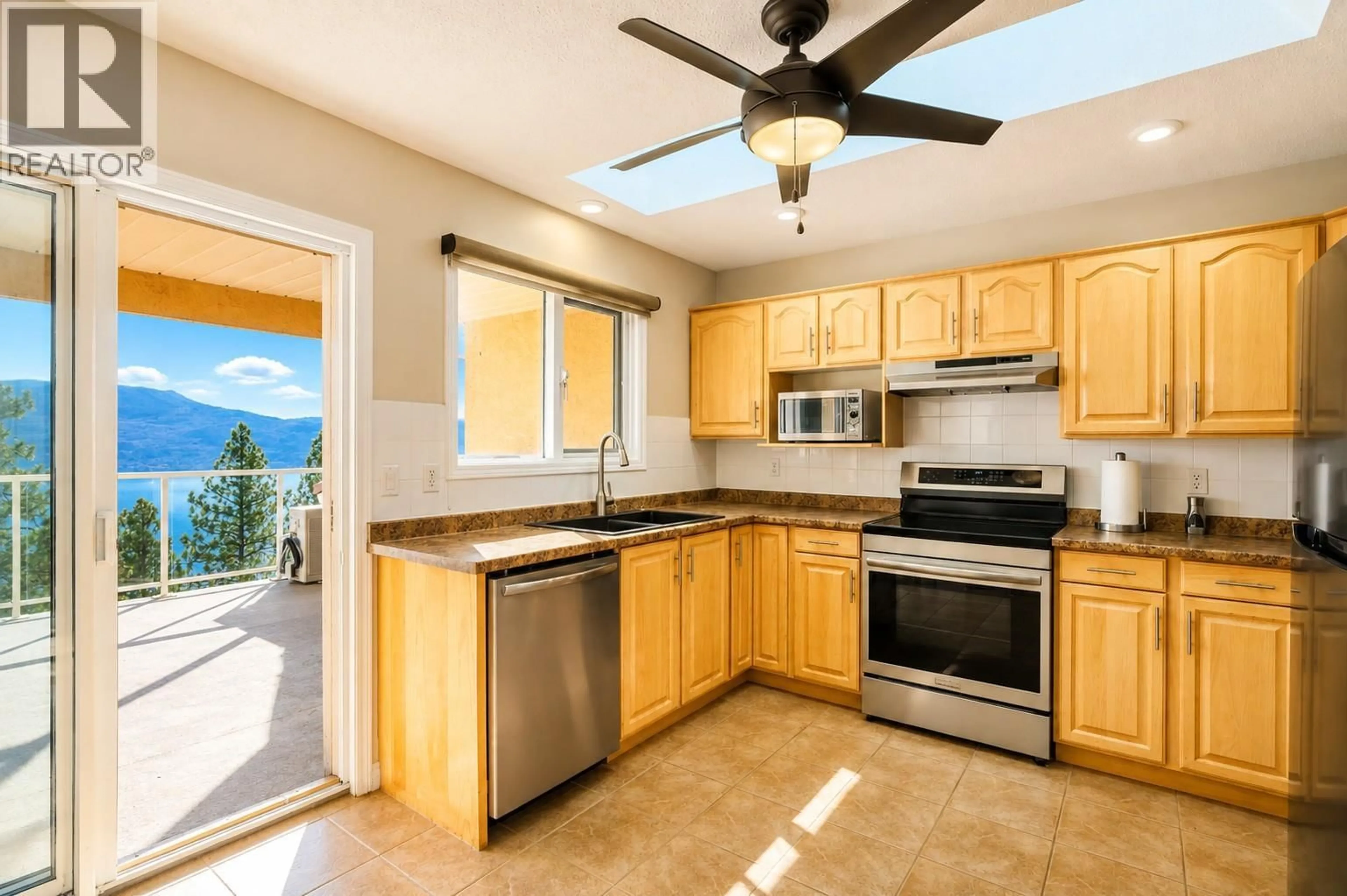 Open concept kitchen, ceramic/tile floor for 204 - 4450 PONDEROSA DRIVE, Peachland British Columbia V0H1X5