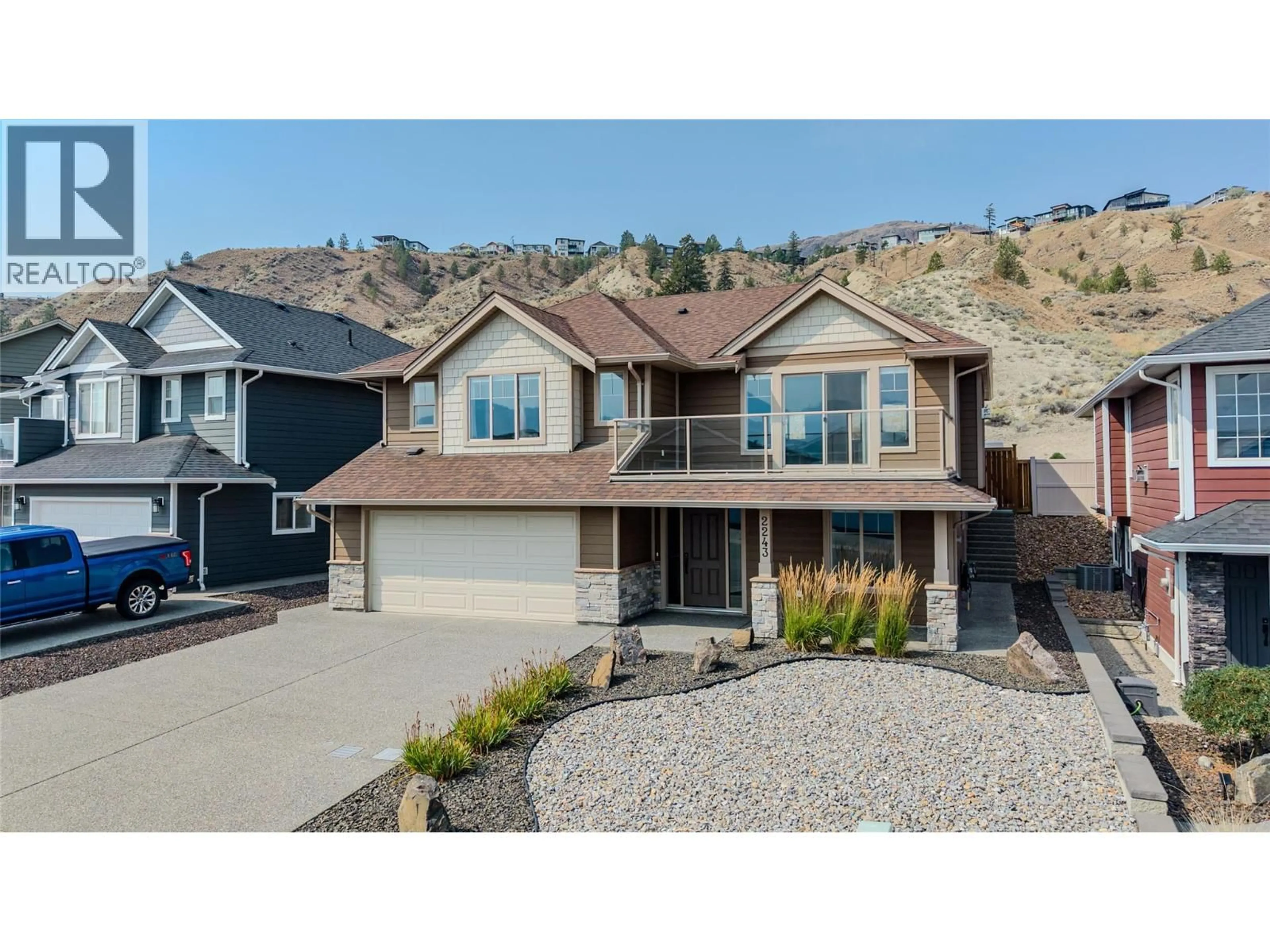 Home with vinyl exterior material, street for 2243 GRASSLANDS BOULEVARD, Kamloops British Columbia V2B0E3