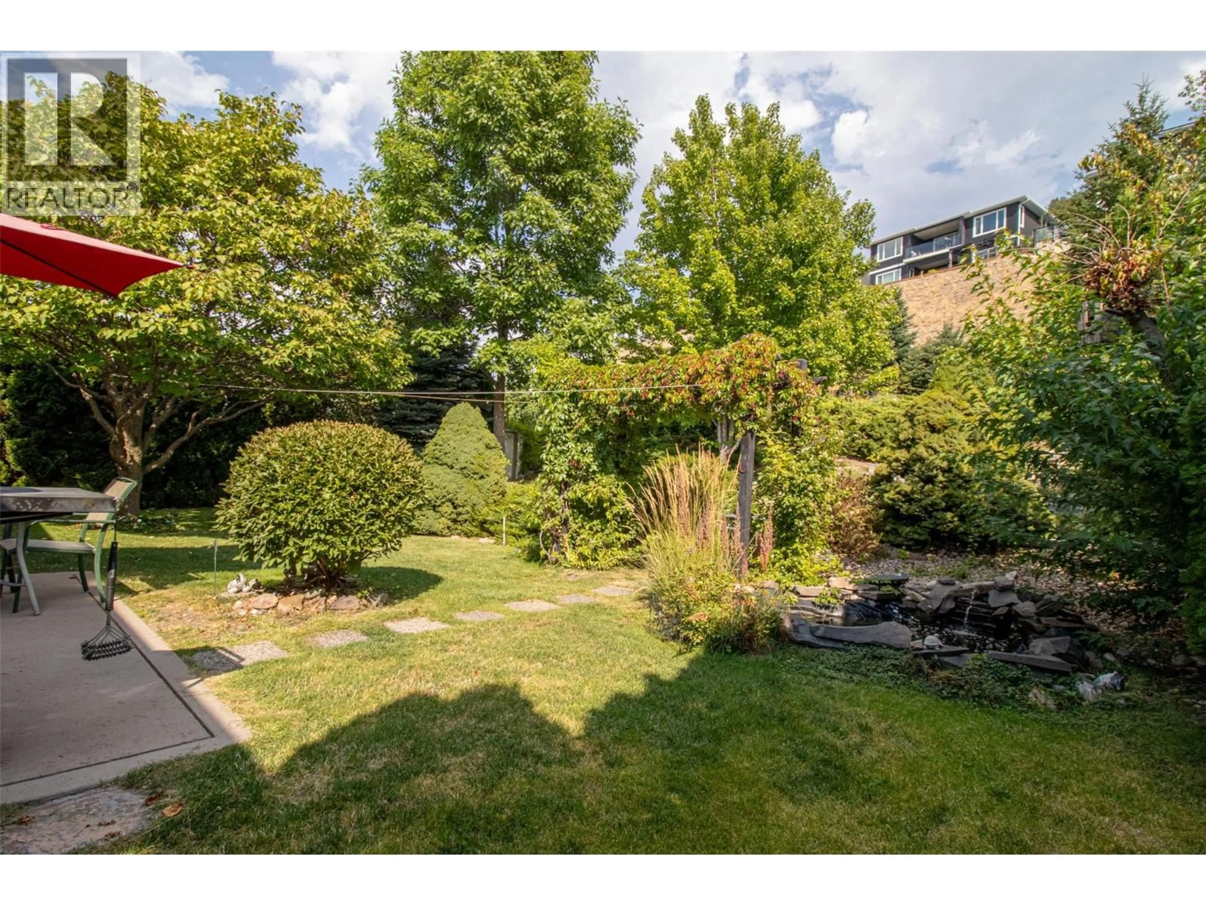 A pic from outside/outdoor area/front of a property/back of a property/a pic from drone, forest/trees view for 843 LONE PINE DRIVE, Kelowna British Columbia V1P1A1