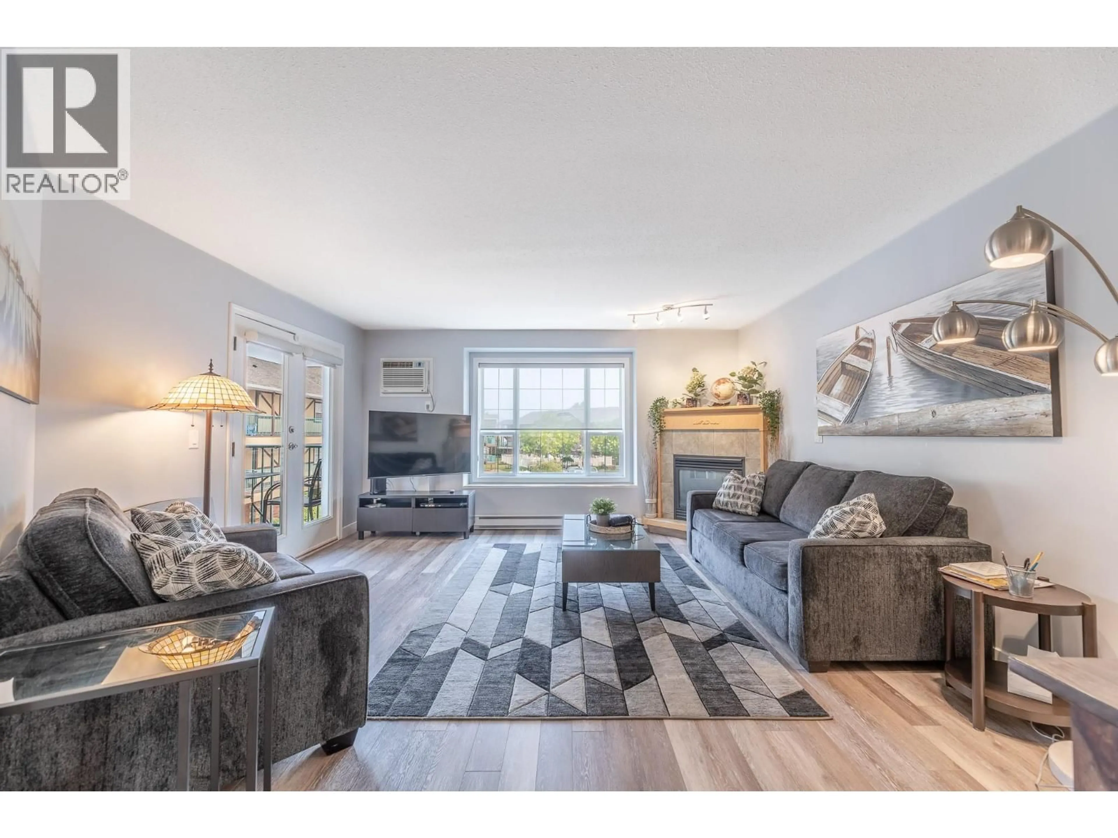 Living room with furniture, wood/laminate floor for 203 - 850 RAILWAY LANE, Okanagan Falls British Columbia V0H1R4