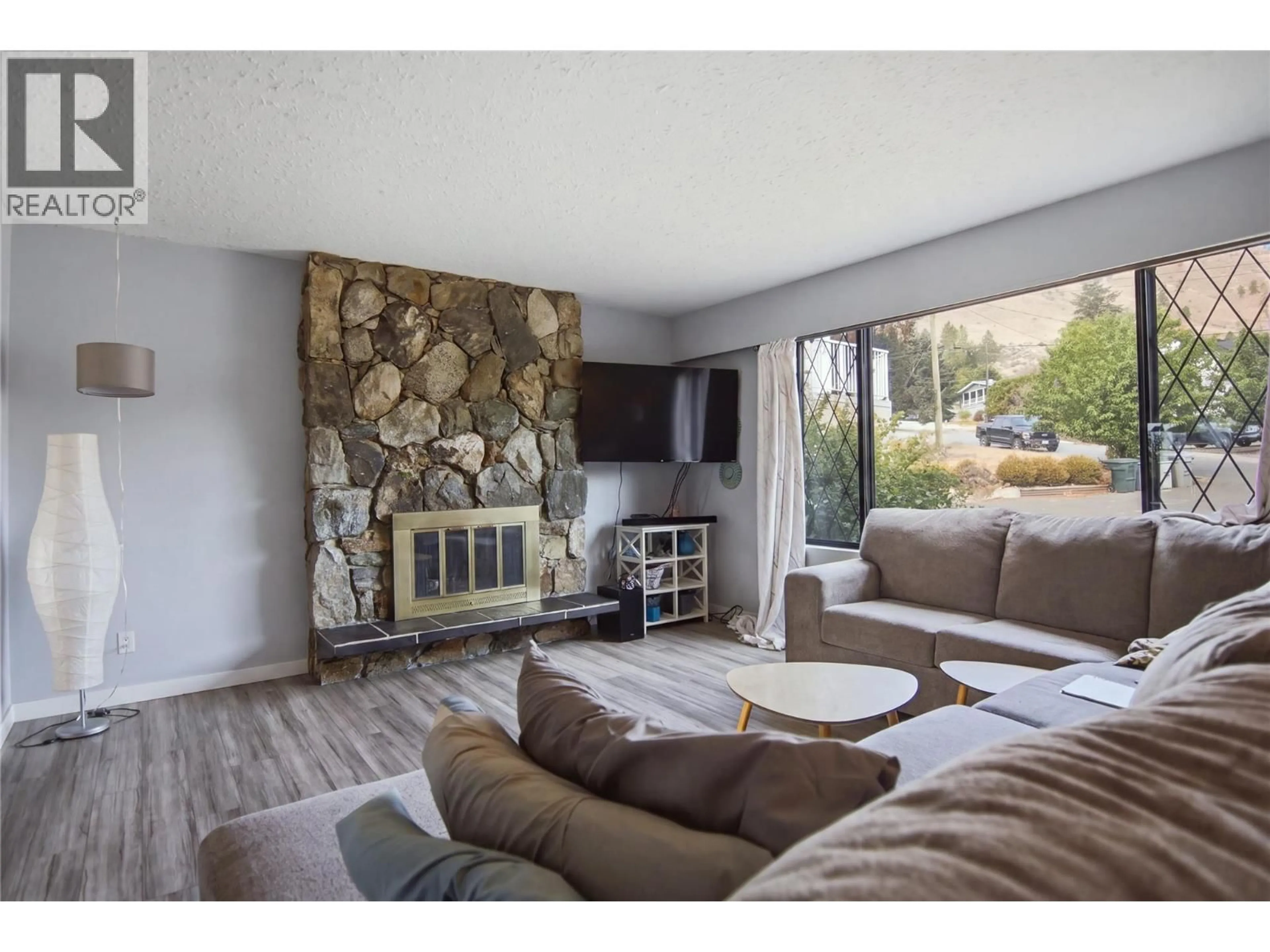 Living room with furniture, wood/laminate floor for 815 KAMBIA CRESCENT, Kamloops British Columbia V2B7M8