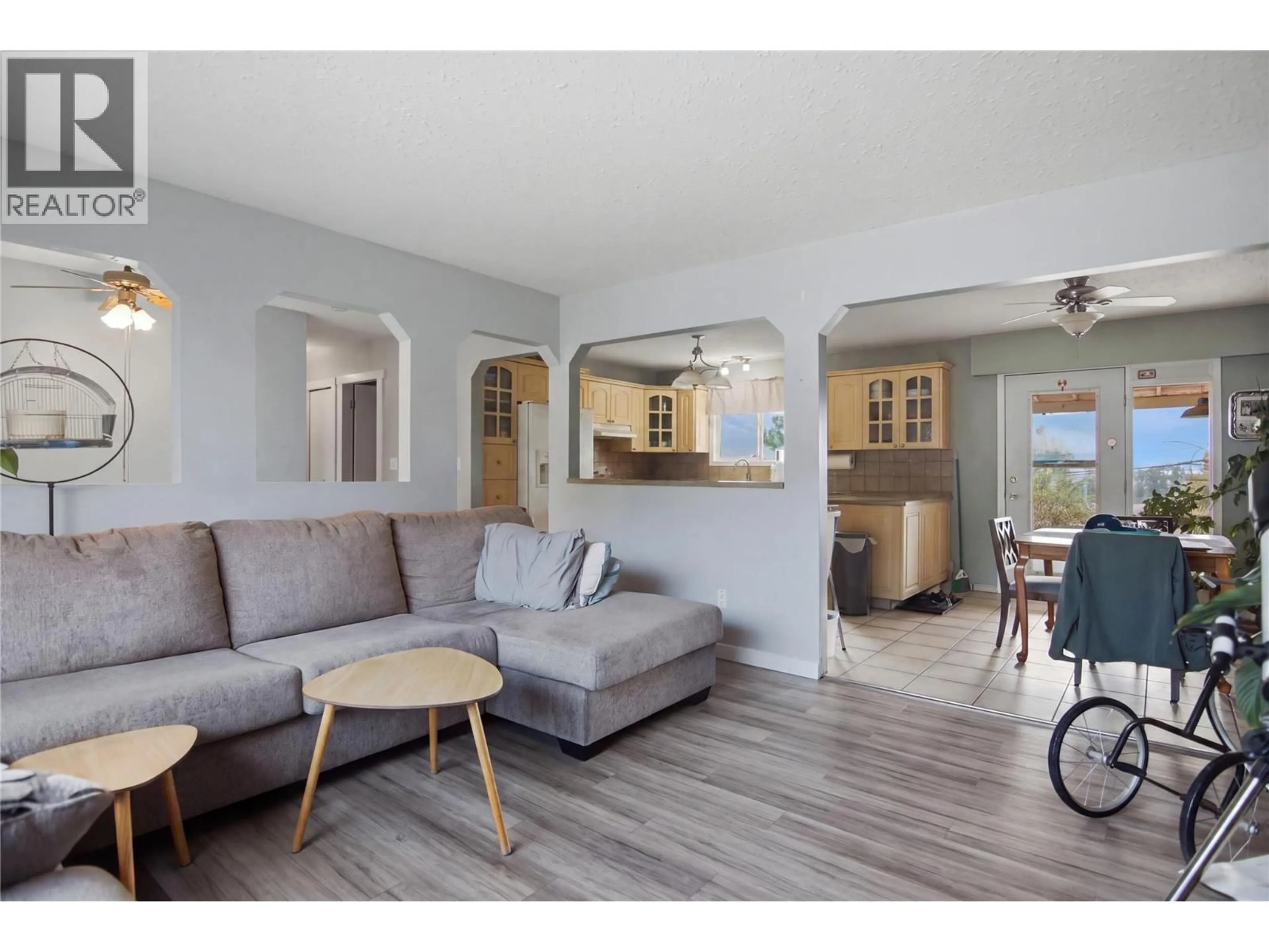 Living room with furniture, wood/laminate floor for 815 KAMBIA CRESCENT, Kamloops British Columbia V2B7M8