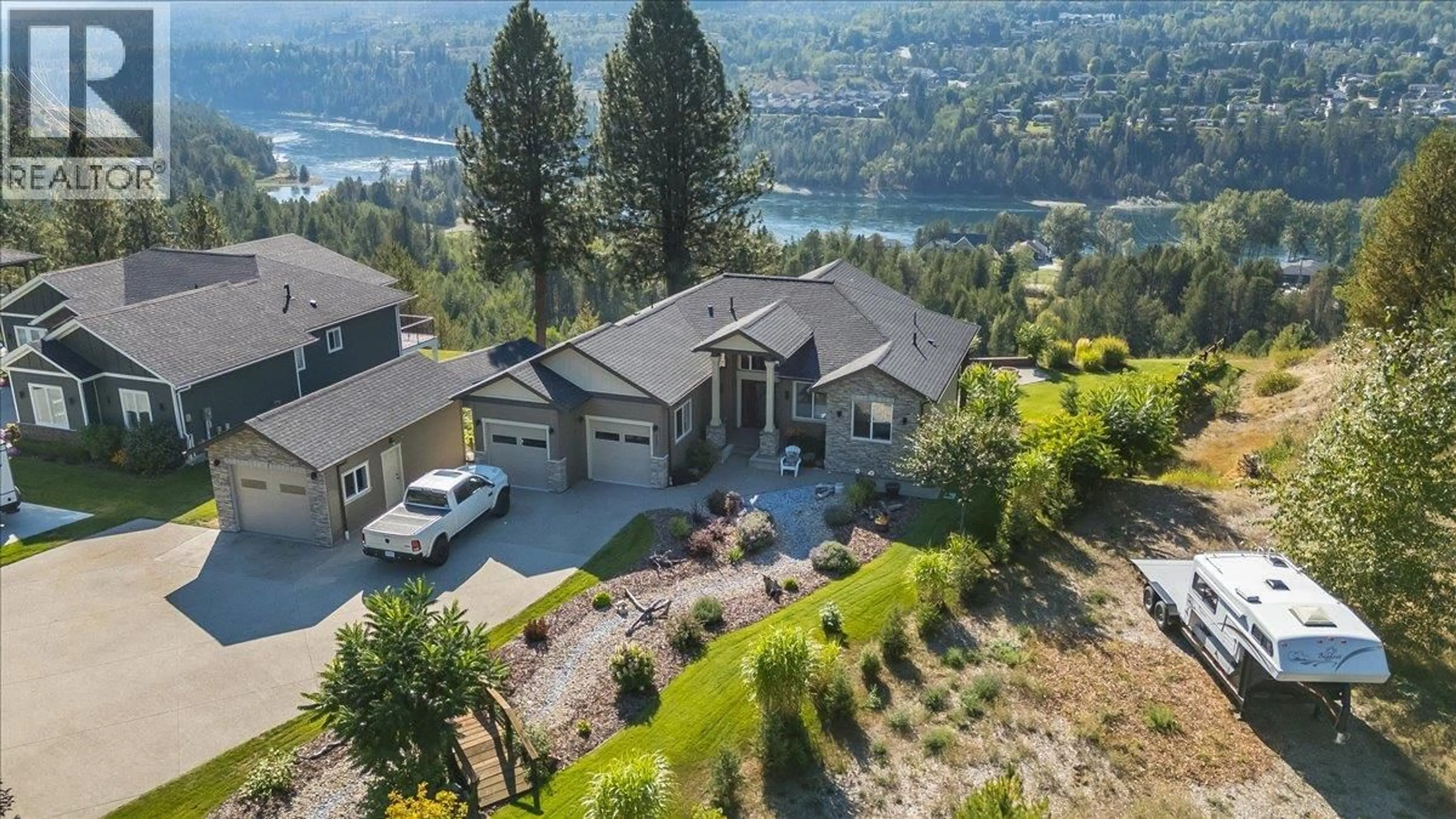 A pic from outside/outdoor area/front of a property/back of a property/a pic from drone, water/lake/river/ocean view for 737 PRAIRIE SOUTH ROAD, Castlegar British Columbia V1N4K6