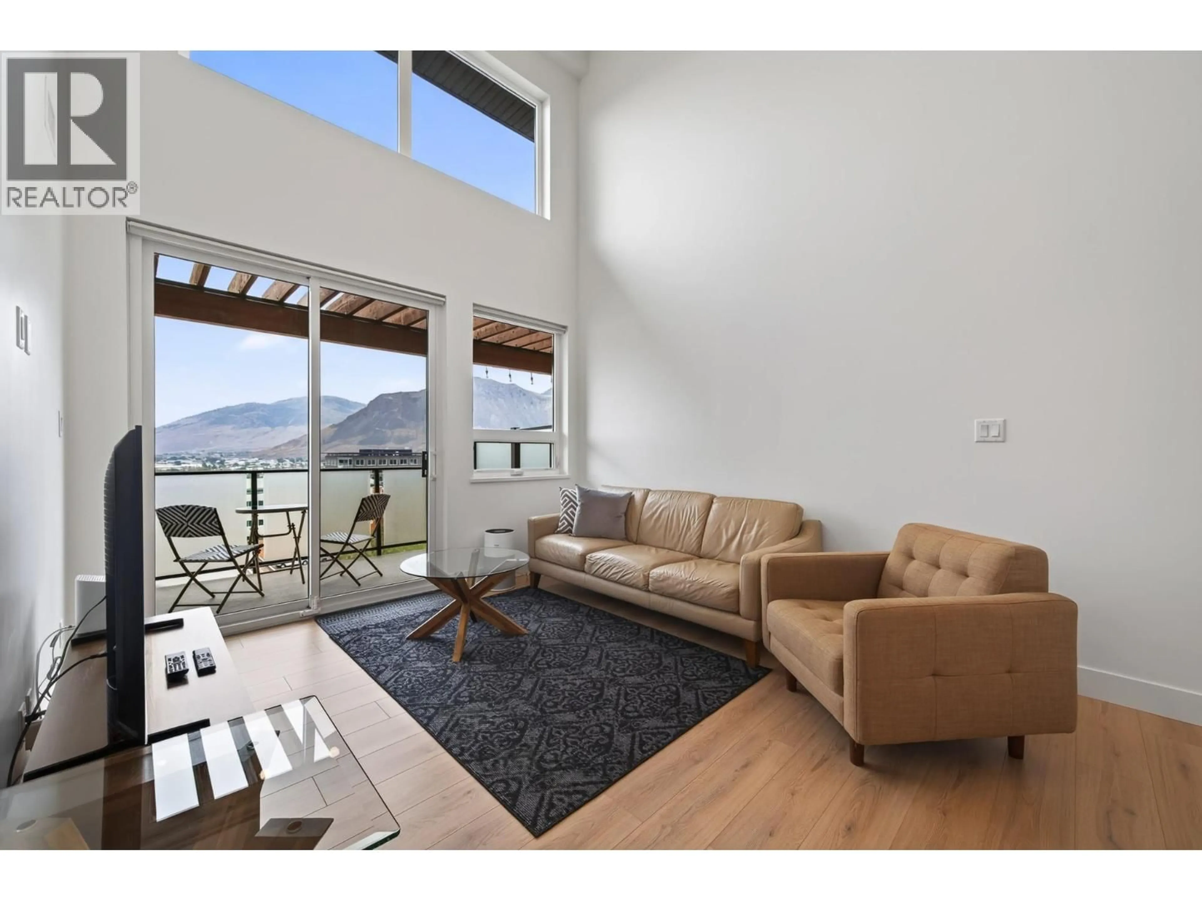 Living room with furniture, wood/laminate floor for 621 - 444 ST PAUL STREET, Kamloops British Columbia V2C2J6