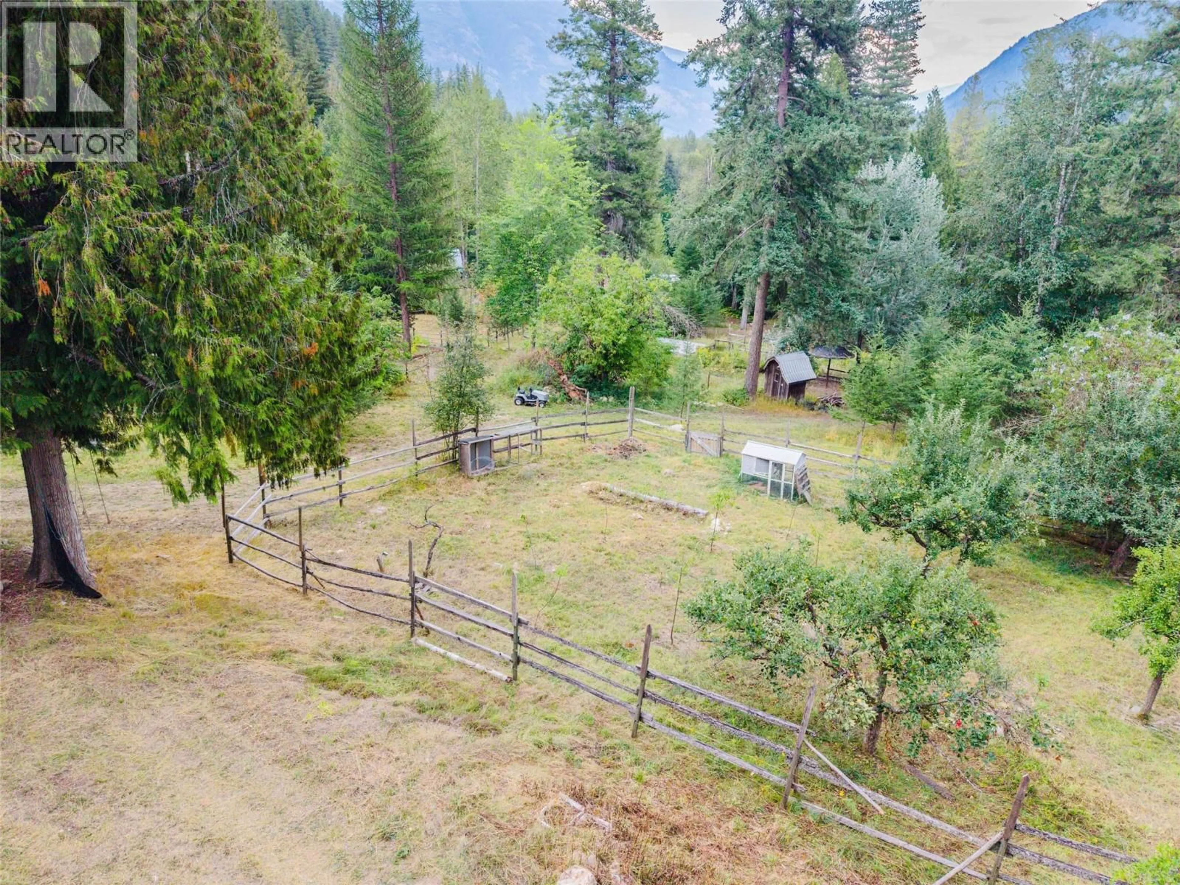 A pic from outside/outdoor area/front of a property/back of a property/a pic from drone, forest/trees view for 3360 LITTLE SLOCAN SOUTH ROAD, Passmore British Columbia V0G2J0