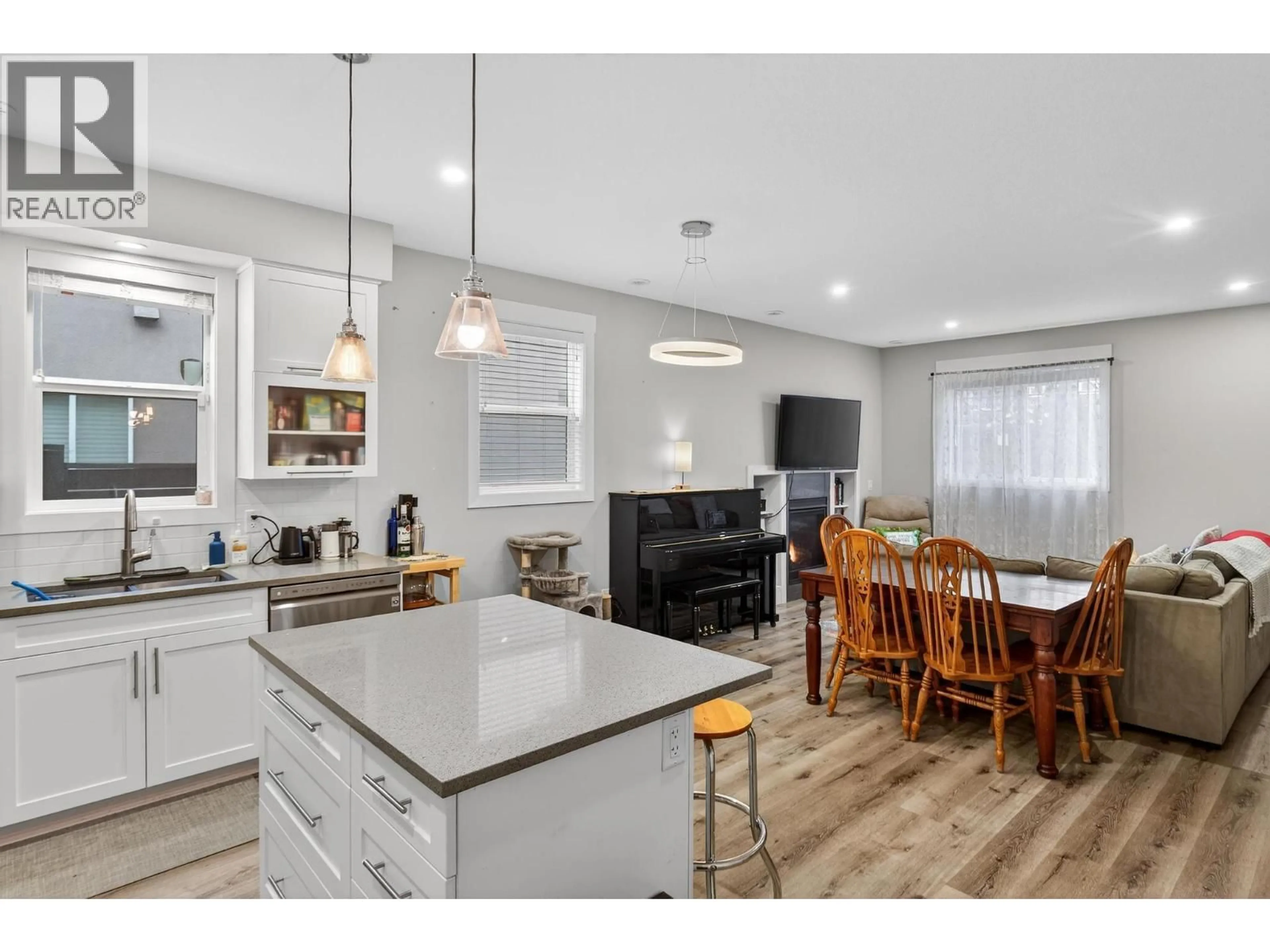 Open concept kitchen, wood/laminate floor for 1932 ETHEL STREET, Kelowna British Columbia V1Y2Z5