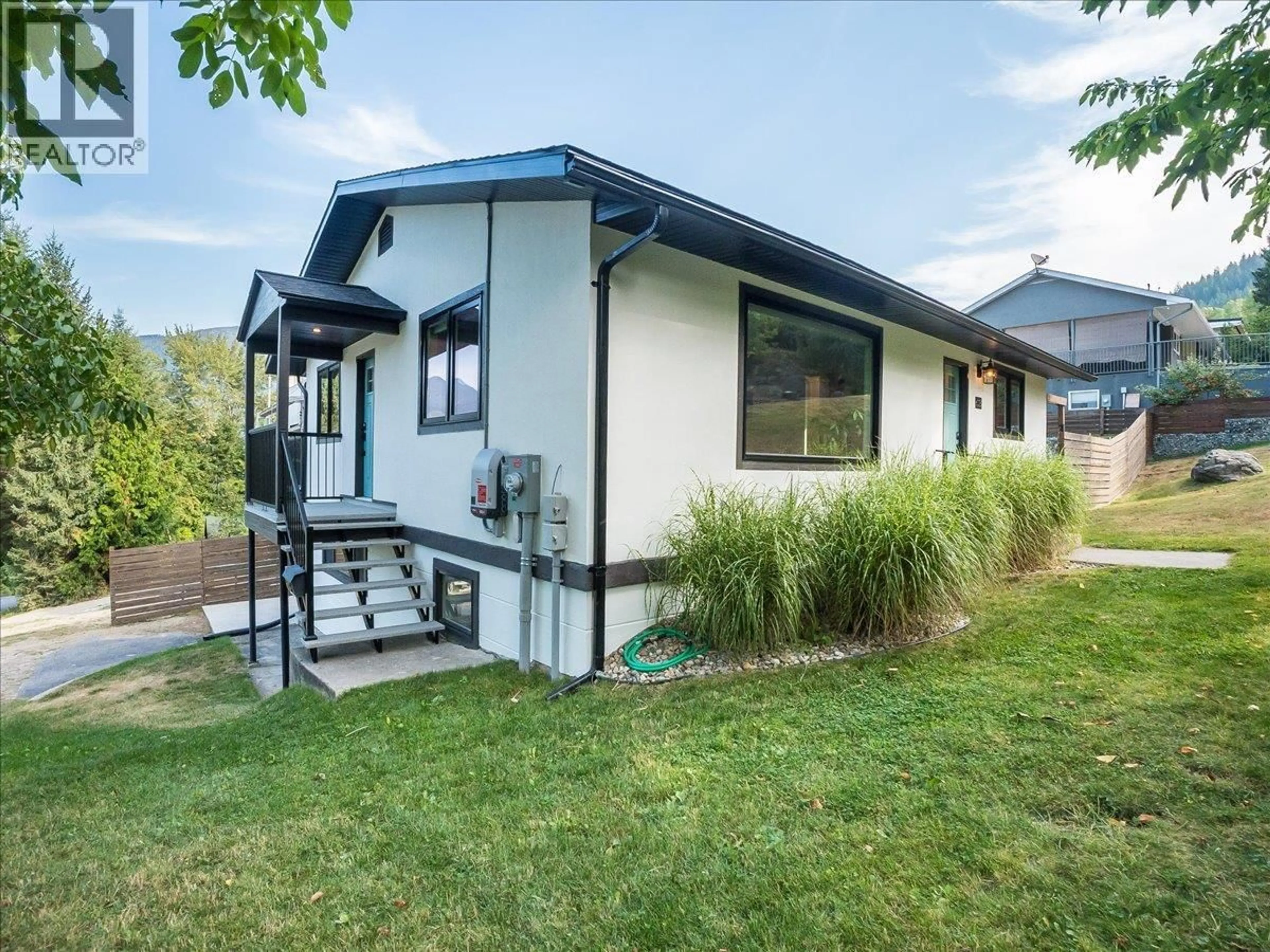 Home with vinyl exterior material, street for 603 DELBRUCK STREET, Nelson British Columbia V1L5L8