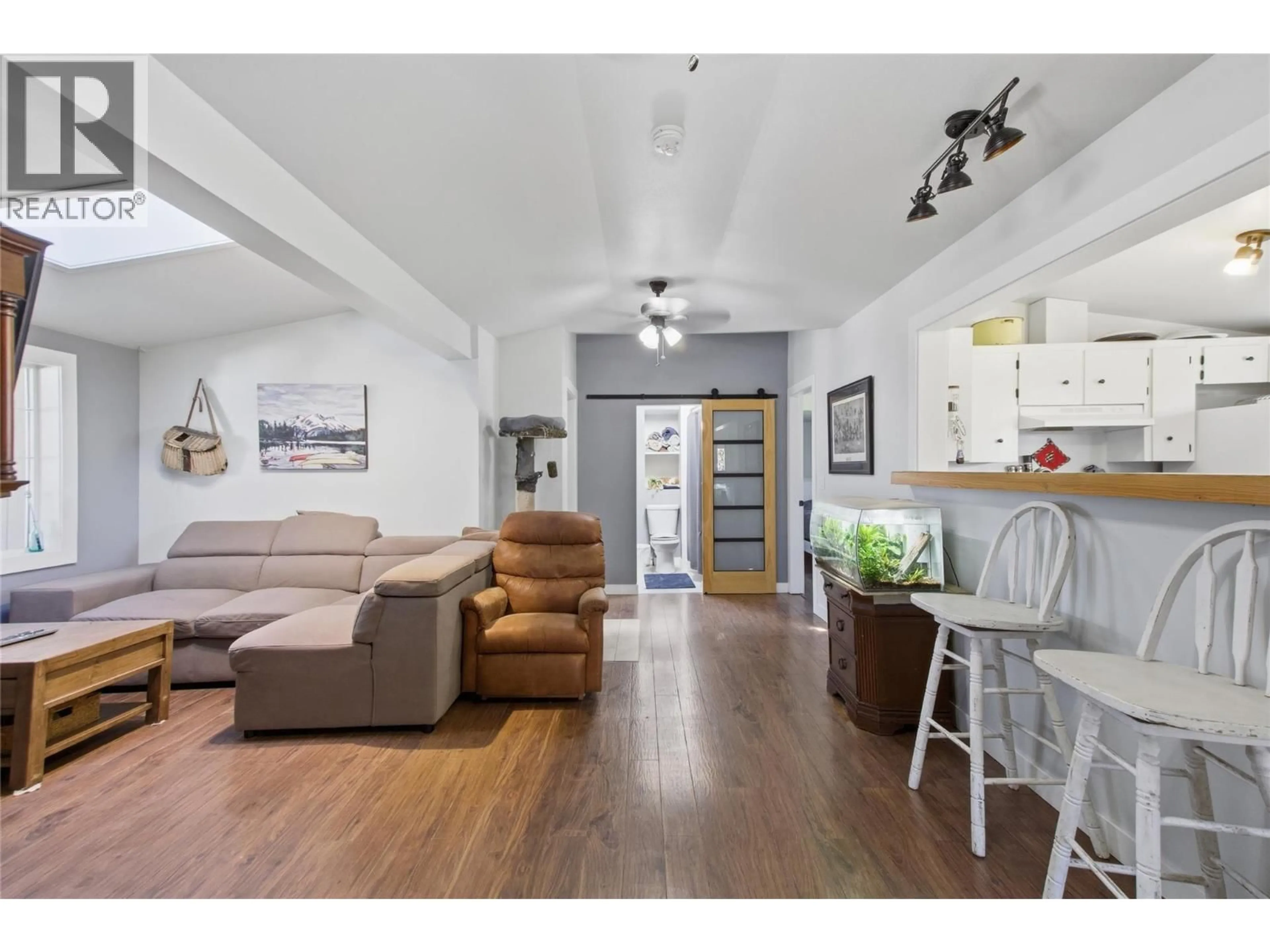 Living room with furniture, wood/laminate floor for 80 VAVASOUR ROAD, Kamloops British Columbia V0K2J0