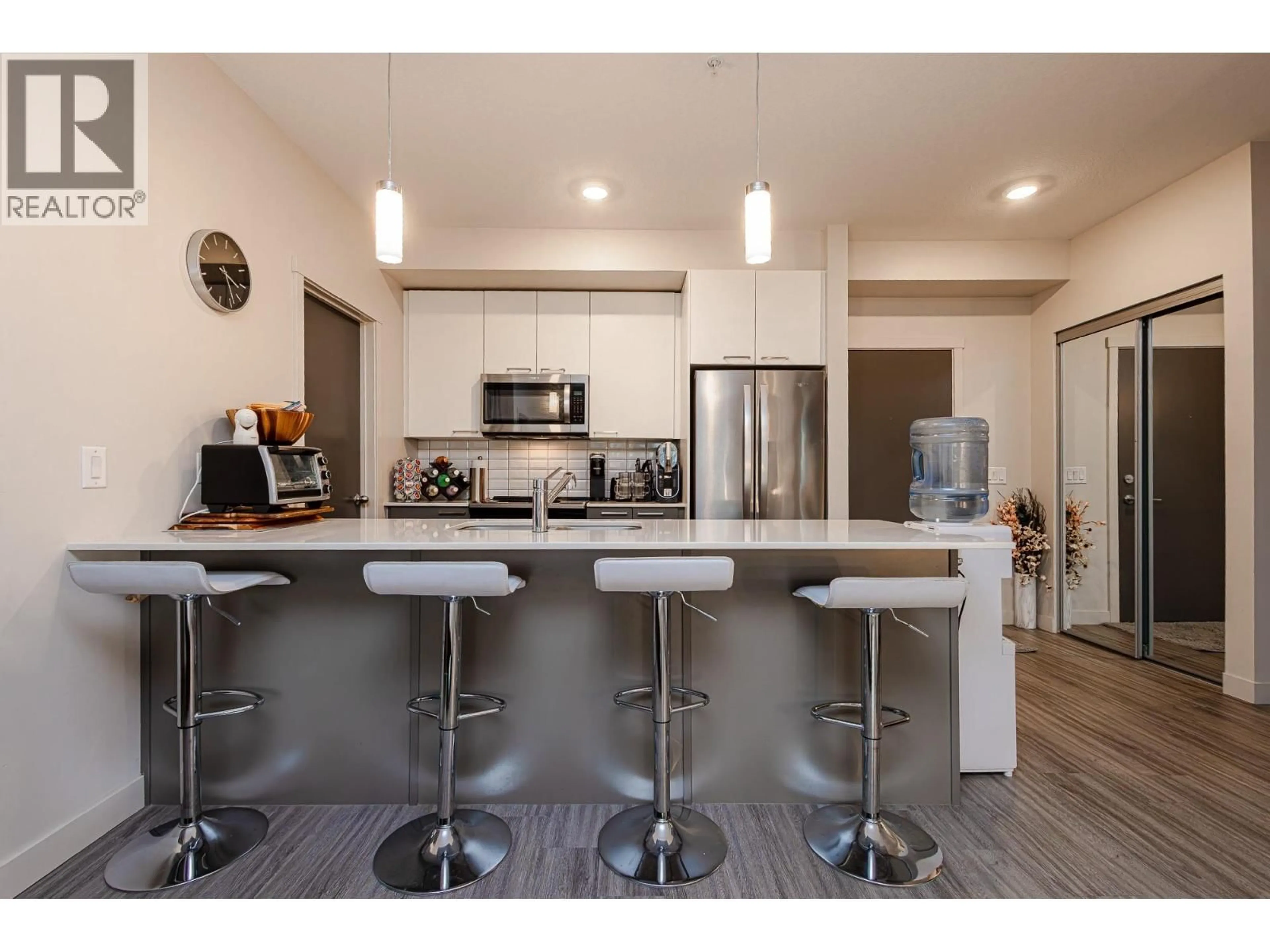 Open concept kitchen, wood/laminate floor for 101 - 2250 MAJOROS ROAD, West Kelowna British Columbia V4T0A6
