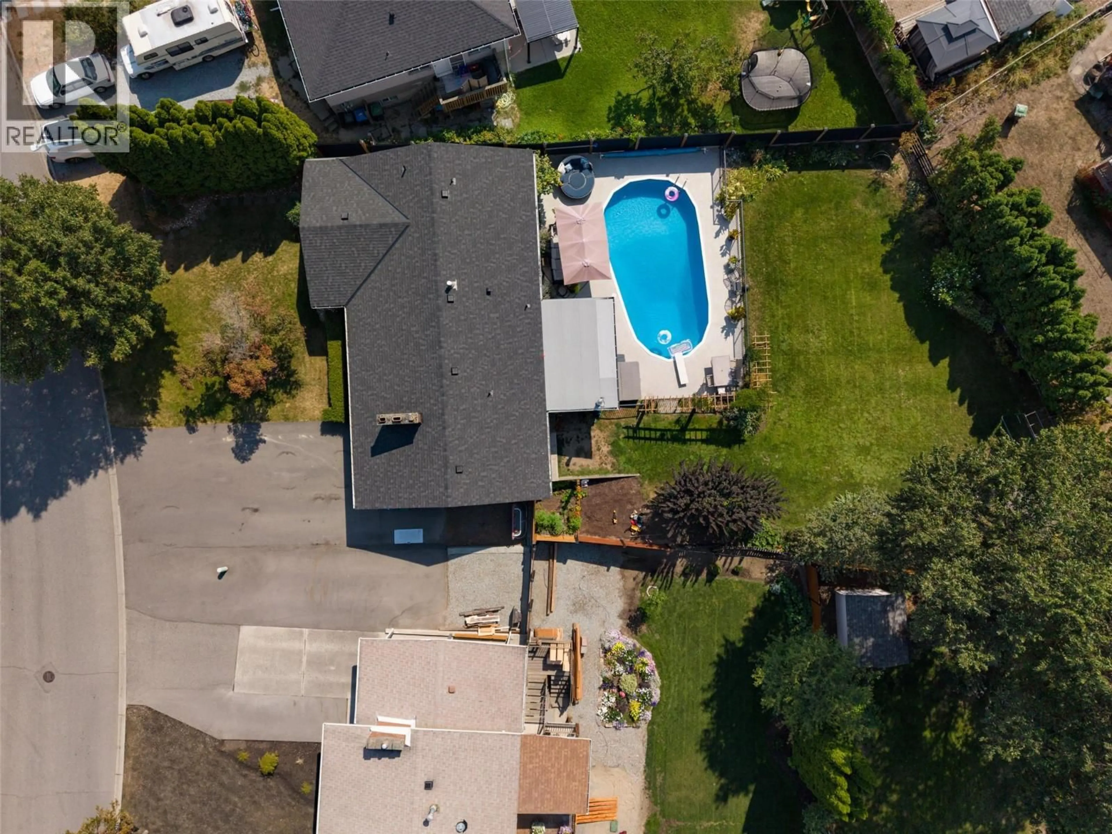 A pic from outside/outdoor area/front of a property/back of a property/a pic from drone, street for 1126 PINECREST LANE, Kelowna British Columbia V1Y4L5