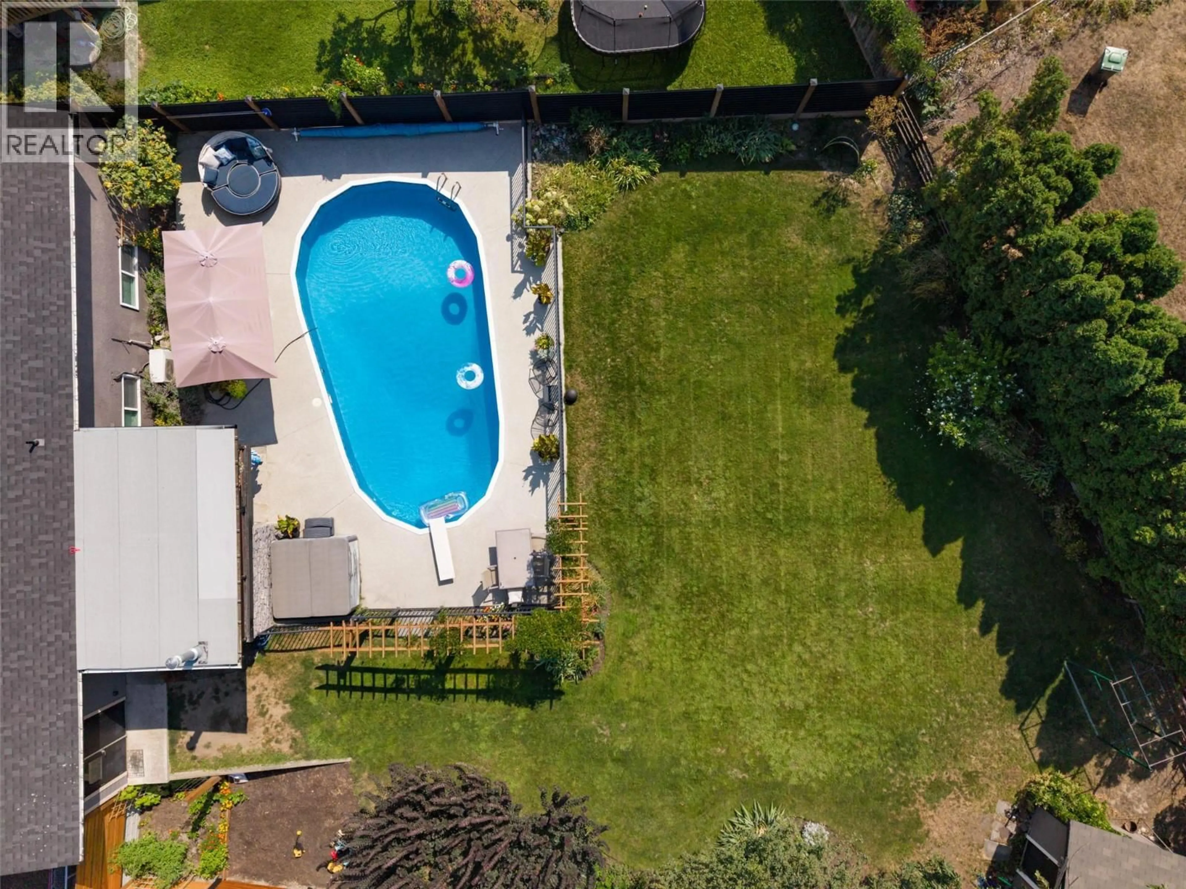 A pic from outside/outdoor area/front of a property/back of a property/a pic from drone, unknown for 1126 PINECREST LANE, Kelowna British Columbia V1Y4L5