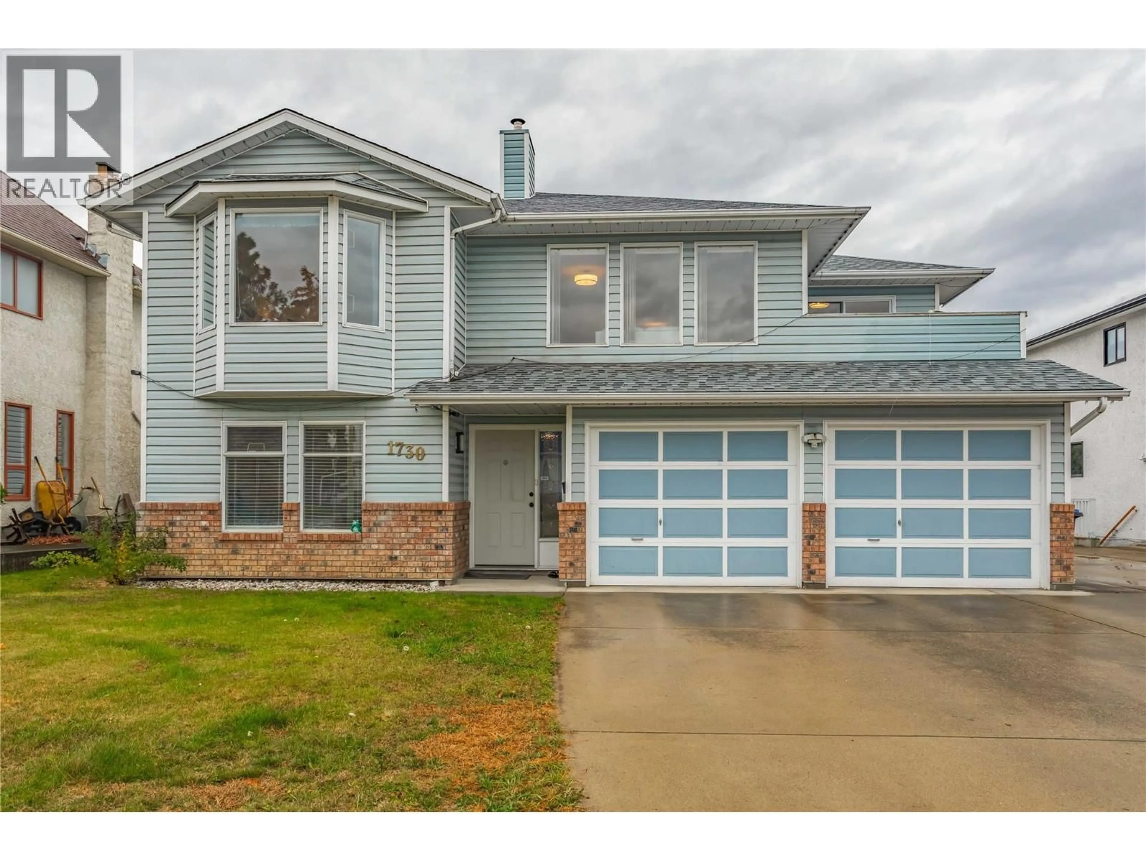 Home with vinyl exterior material, street for 1730 SIMPSON COURT, Kelowna British Columbia V1X7C1