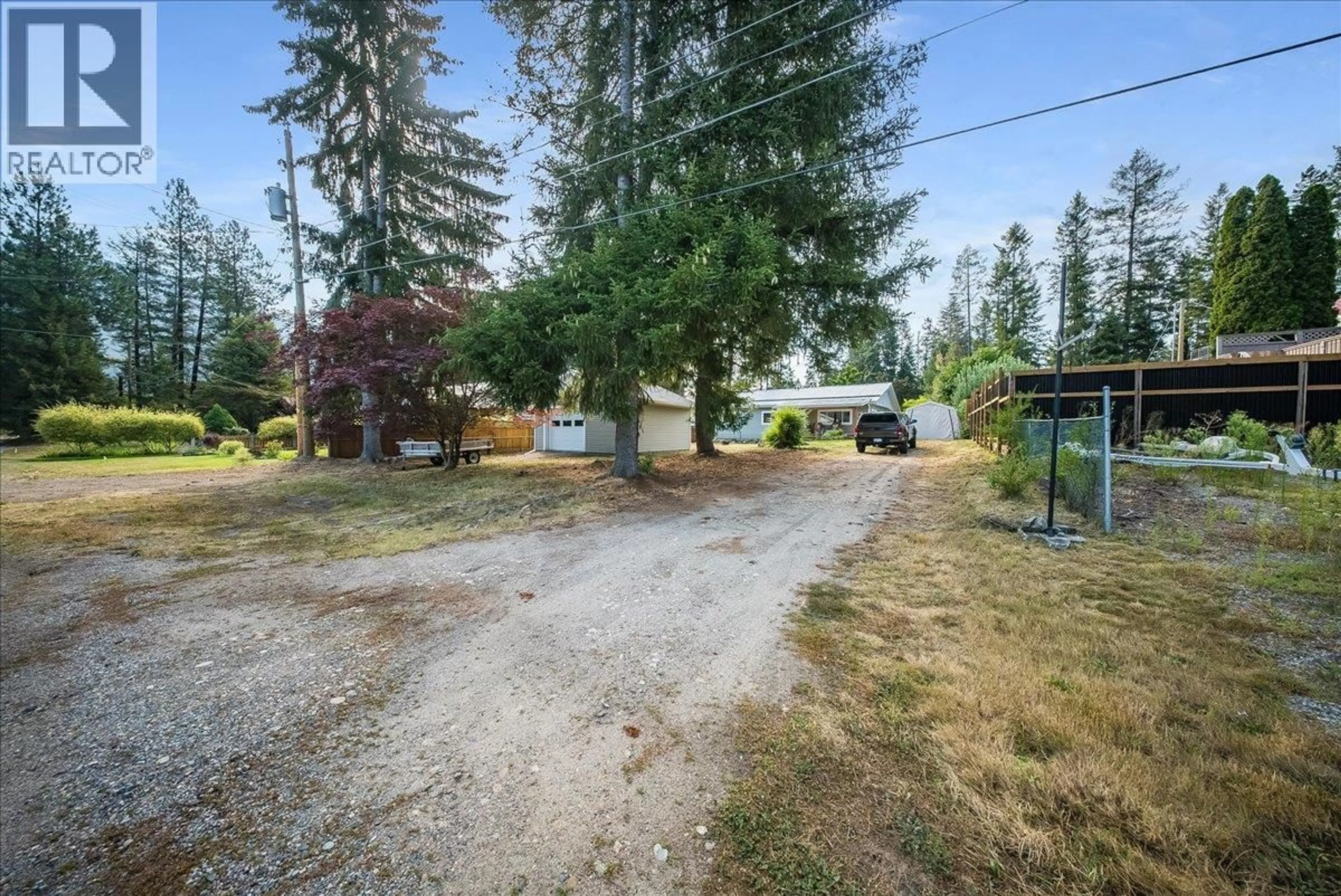 A pic from outside/outdoor area/front of a property/back of a property/a pic from drone, street for 91 HOLMES ROAD, Christina Lake British Columbia V0H1E0
