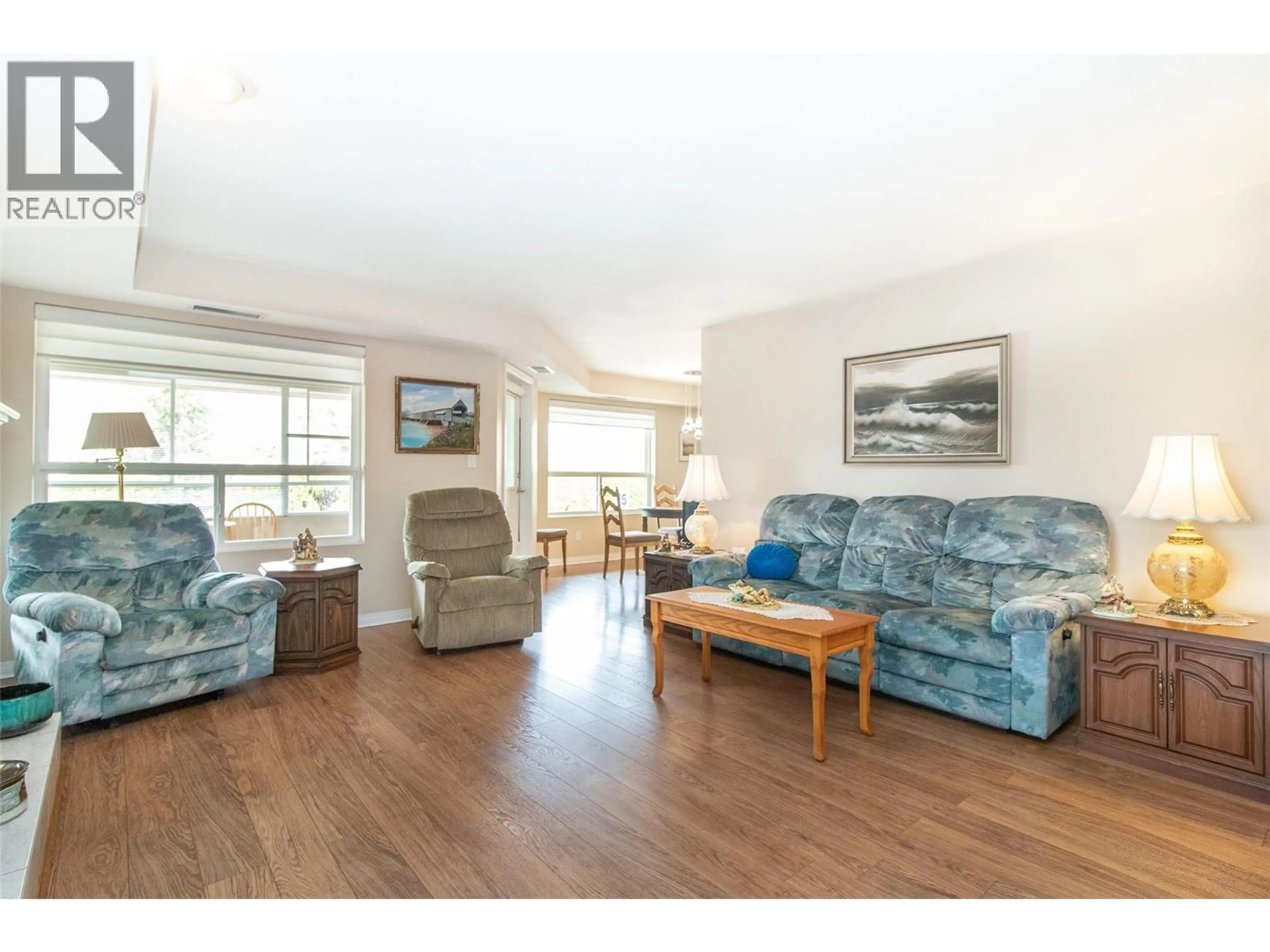 Living room with furniture, wood/laminate floor for 122 - 1965 DURNIN ROAD, Kelowna British Columbia V1X7K6