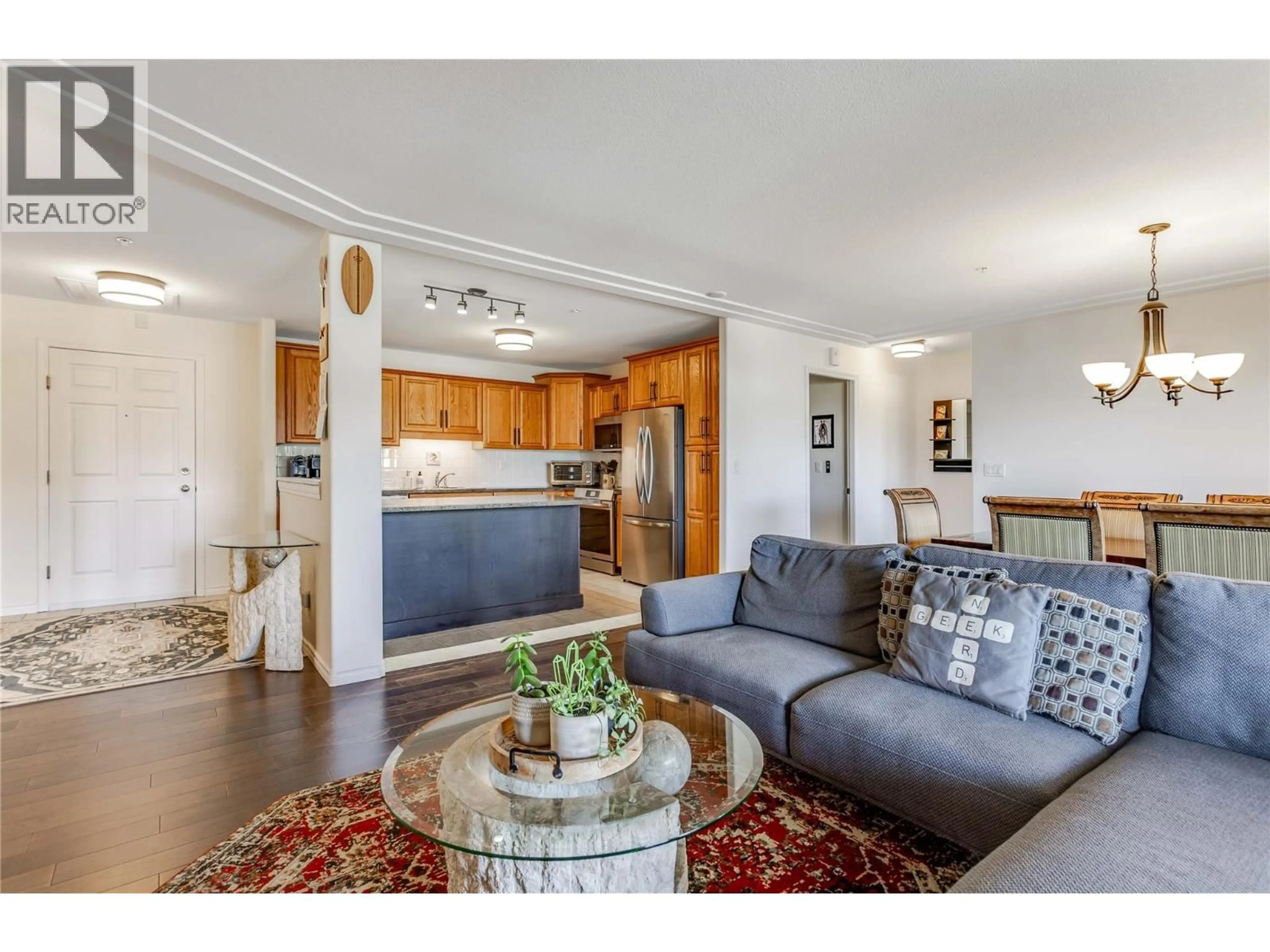 Living room with furniture, wood/laminate floor for 705 - 1967 UNDERHILL STREET, Kelowna British Columbia V1X8C9