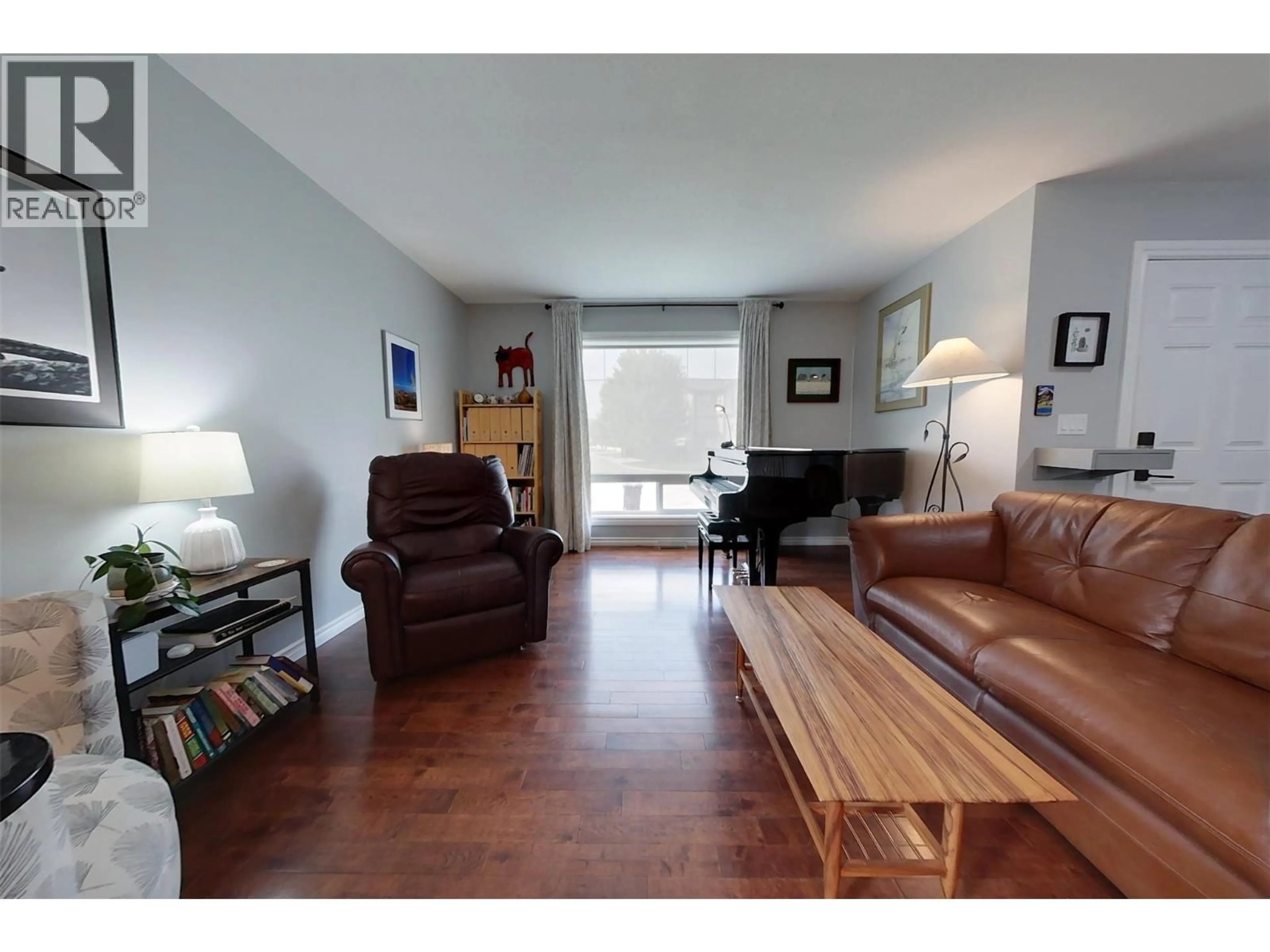 Living room with furniture, wood/laminate floor for 1900 KELOWNA CRESCENT, Cranbrook British Columbia V1C6L6
