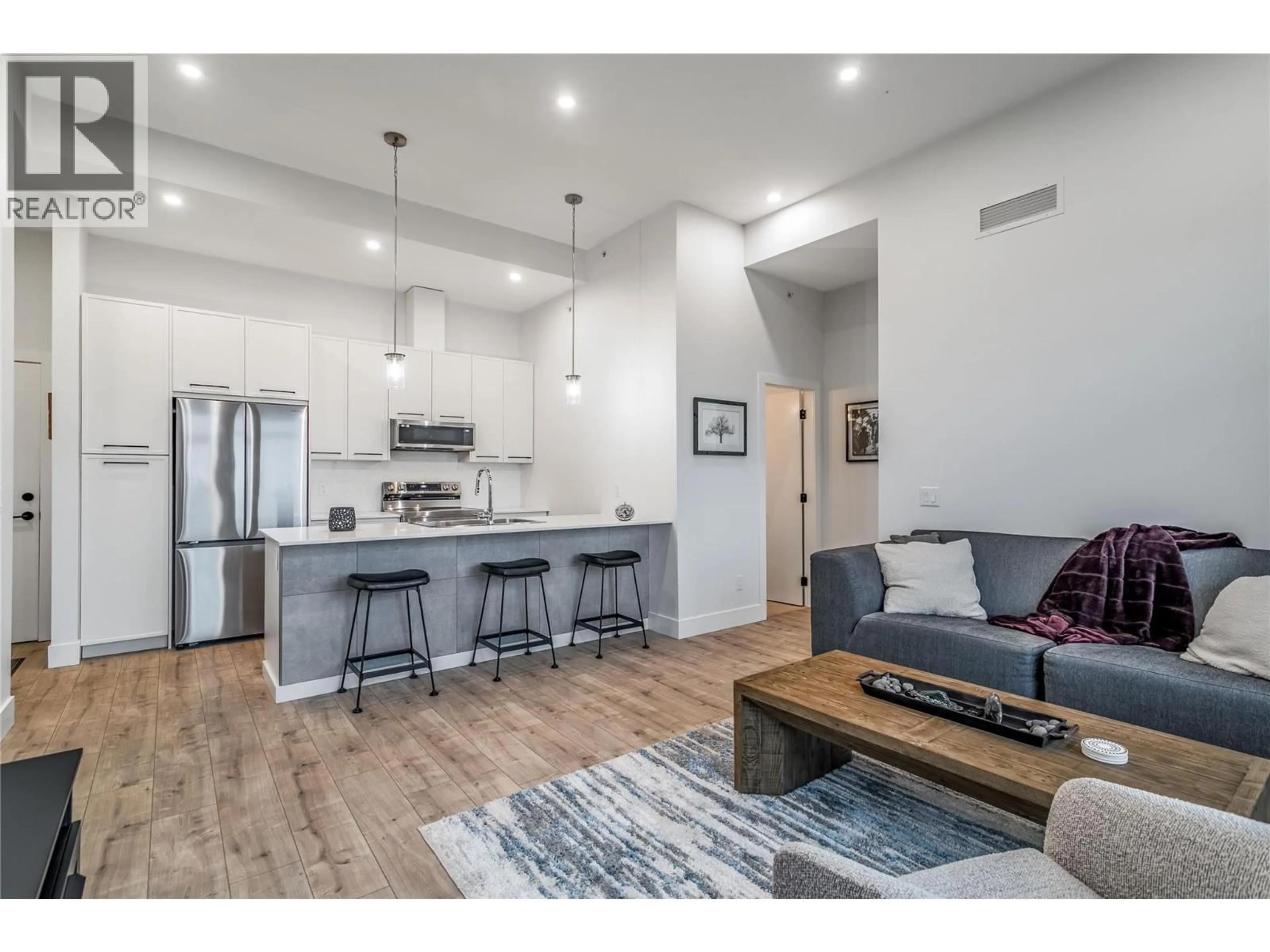 Open concept kitchen, wood/laminate floor for 507 - 1220 PACIFIC AVENUE, Kelowna British Columbia V1Y5T7