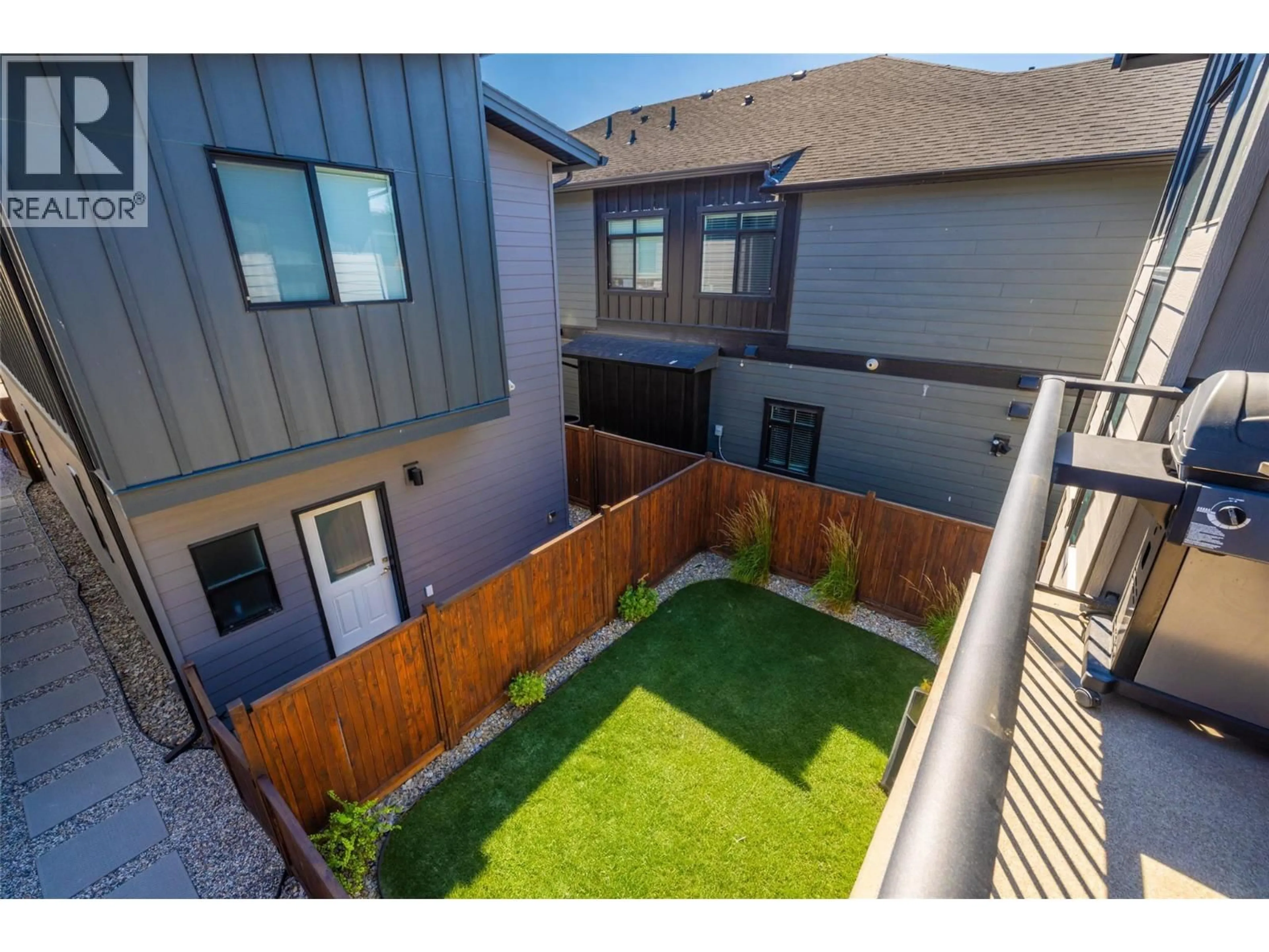 A pic from outside/outdoor area/front of a property/back of a property/a pic from drone, street for 1 - 726 COOPLAND CRESCENT, Kelowna British Columbia V1Y2V1