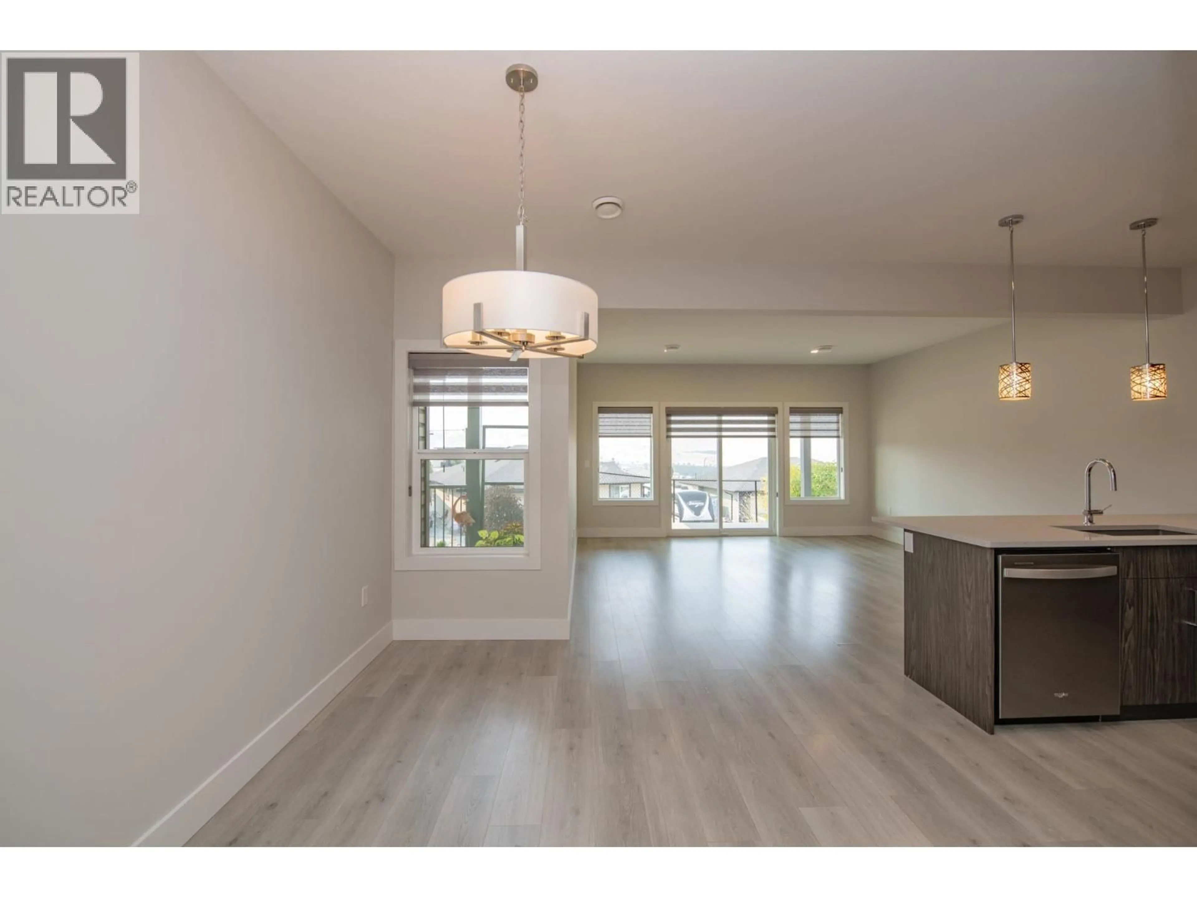 Open concept kitchen, wood/laminate floor for 97 - 933 MT ROBSON PLACE, Vernon British Columbia V1B4G4