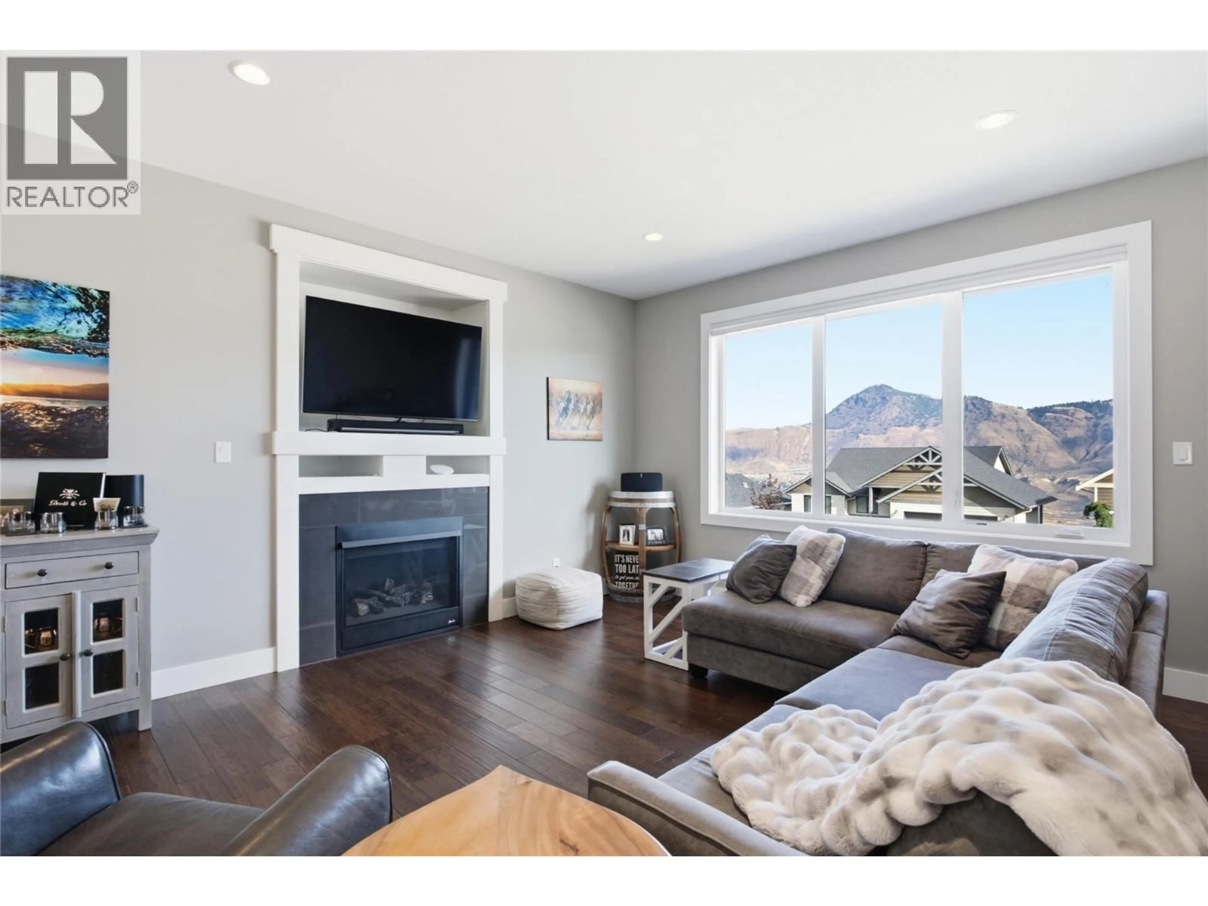 Living room with furniture, wood/laminate floor for 1981 GALORE CRESCENT, Kamloops British Columbia V2E0A7