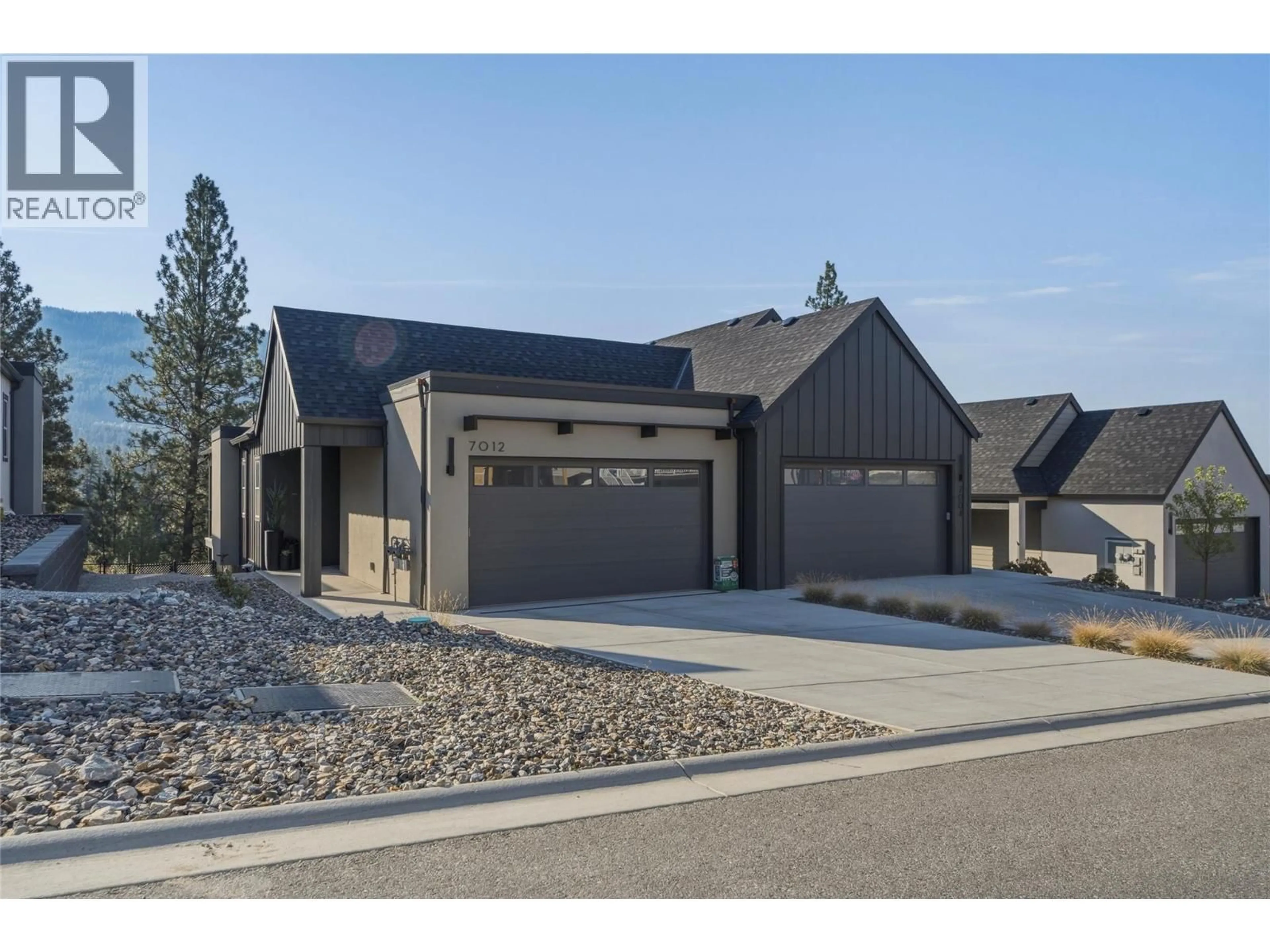 Home with brick exterior material, street for 7012 MANNING PLACE, Vernon British Columbia V1B0B6