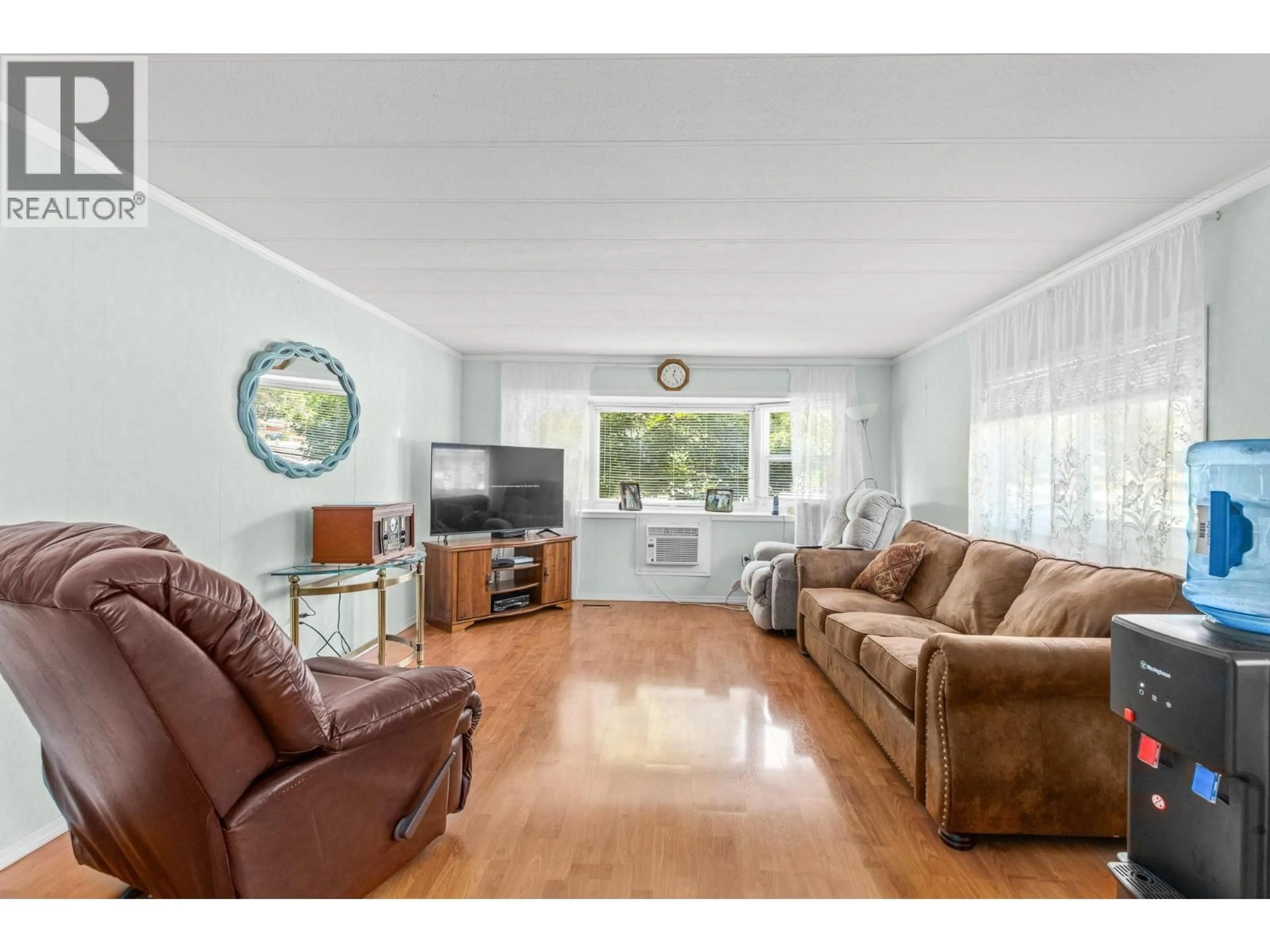 Living room with furniture, wood/laminate floor for 170 - 2500 97B HIGHWAY, Salmon Arm British Columbia V1E1A6