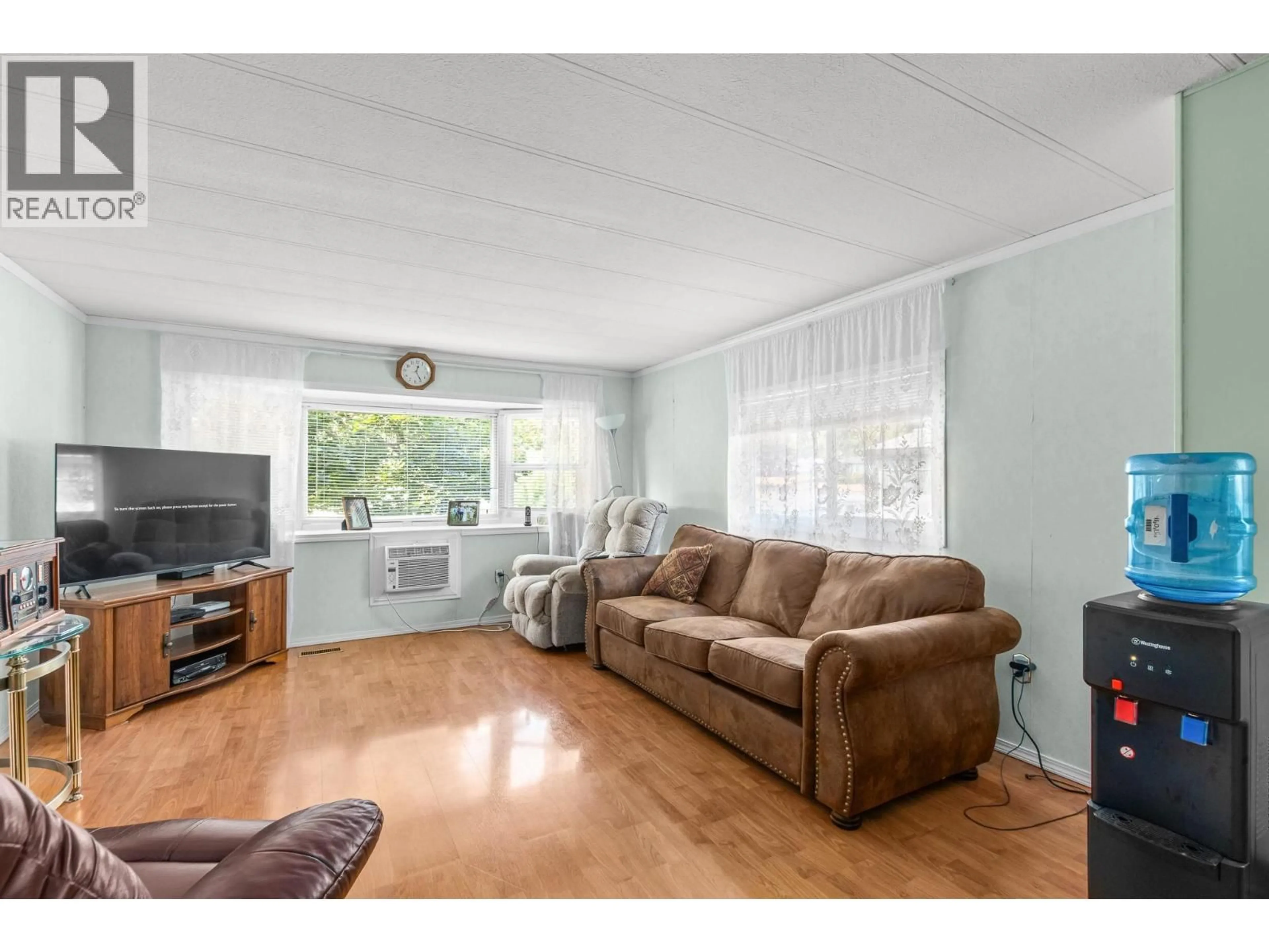 Living room with furniture, wood/laminate floor for 170 - 2500 97B HIGHWAY, Salmon Arm British Columbia V1E1A6
