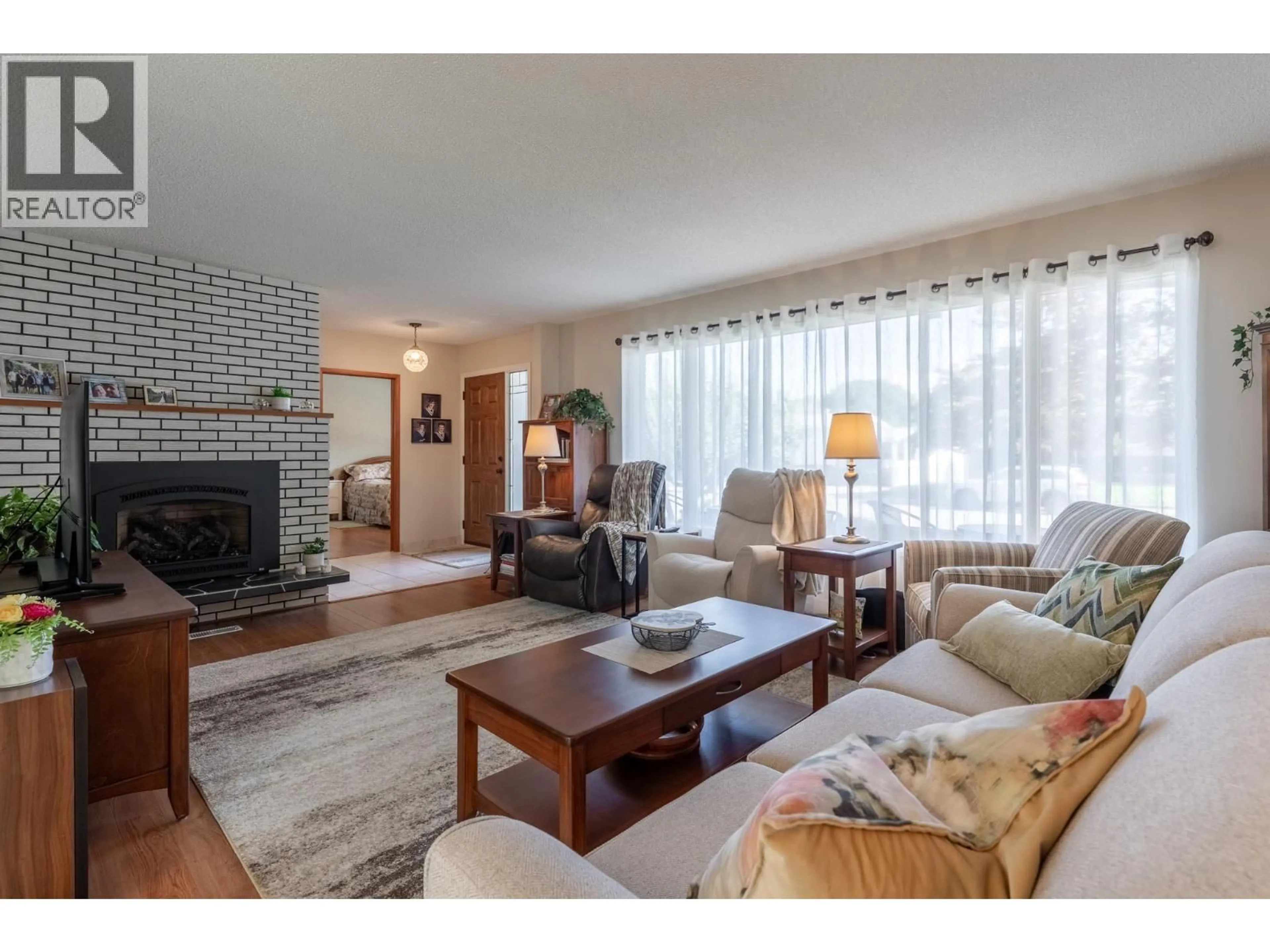 Living room with furniture, unknown for 1306 LOMBARDY SQUARE, Kelowna British Columbia V1Y3S4