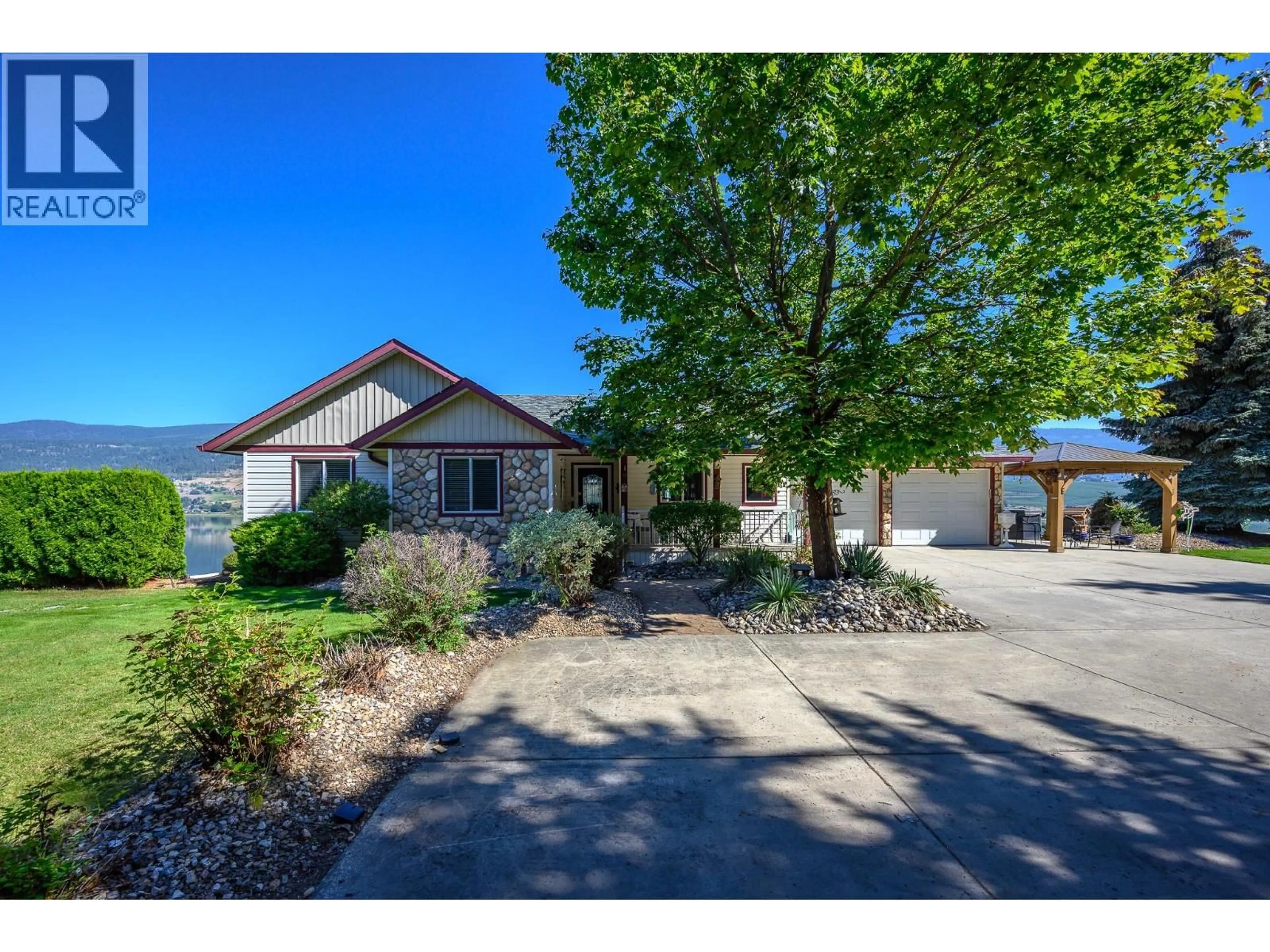 A pic from outside/outdoor area/front of a property/back of a property/a pic from drone, street for 7199 BREMMER ROAD, Vernon British Columbia V1H1W6