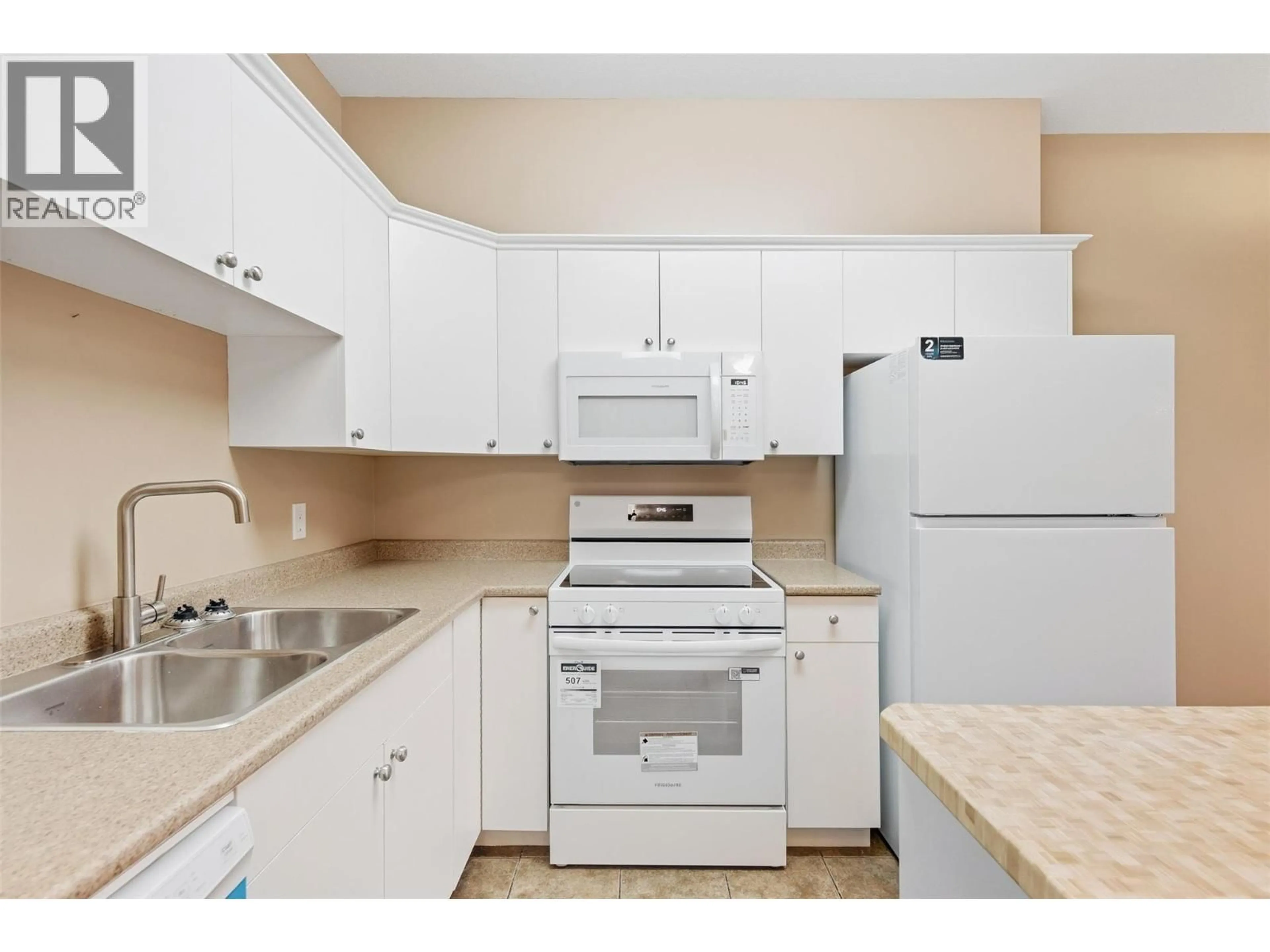 Standard kitchen, unknown for 302 - 1125 BERNARD AVENUE, Kelowna British Columbia V1Y6R3