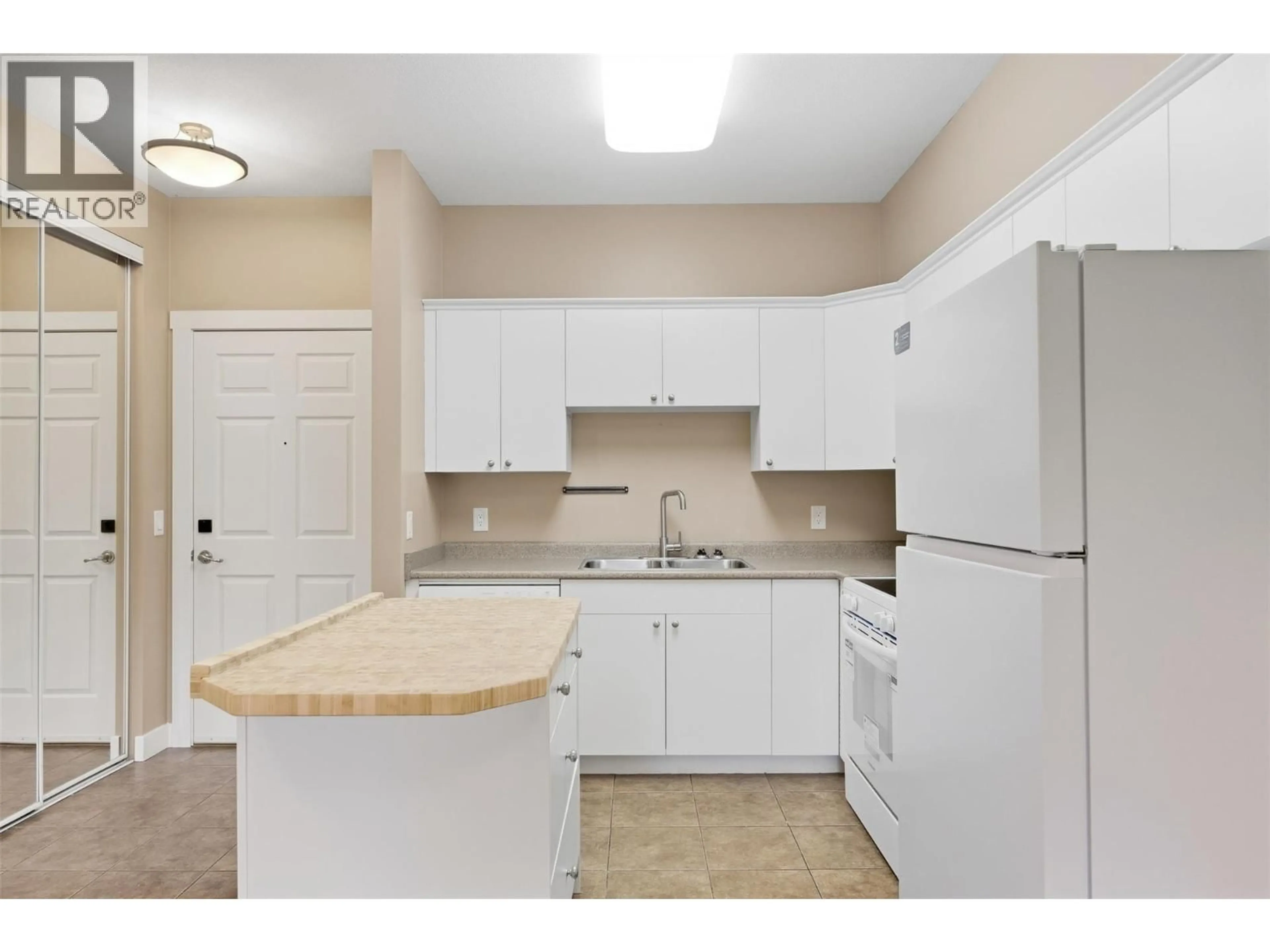 Standard kitchen, unknown for 302 - 1125 BERNARD AVENUE, Kelowna British Columbia V1Y6R3