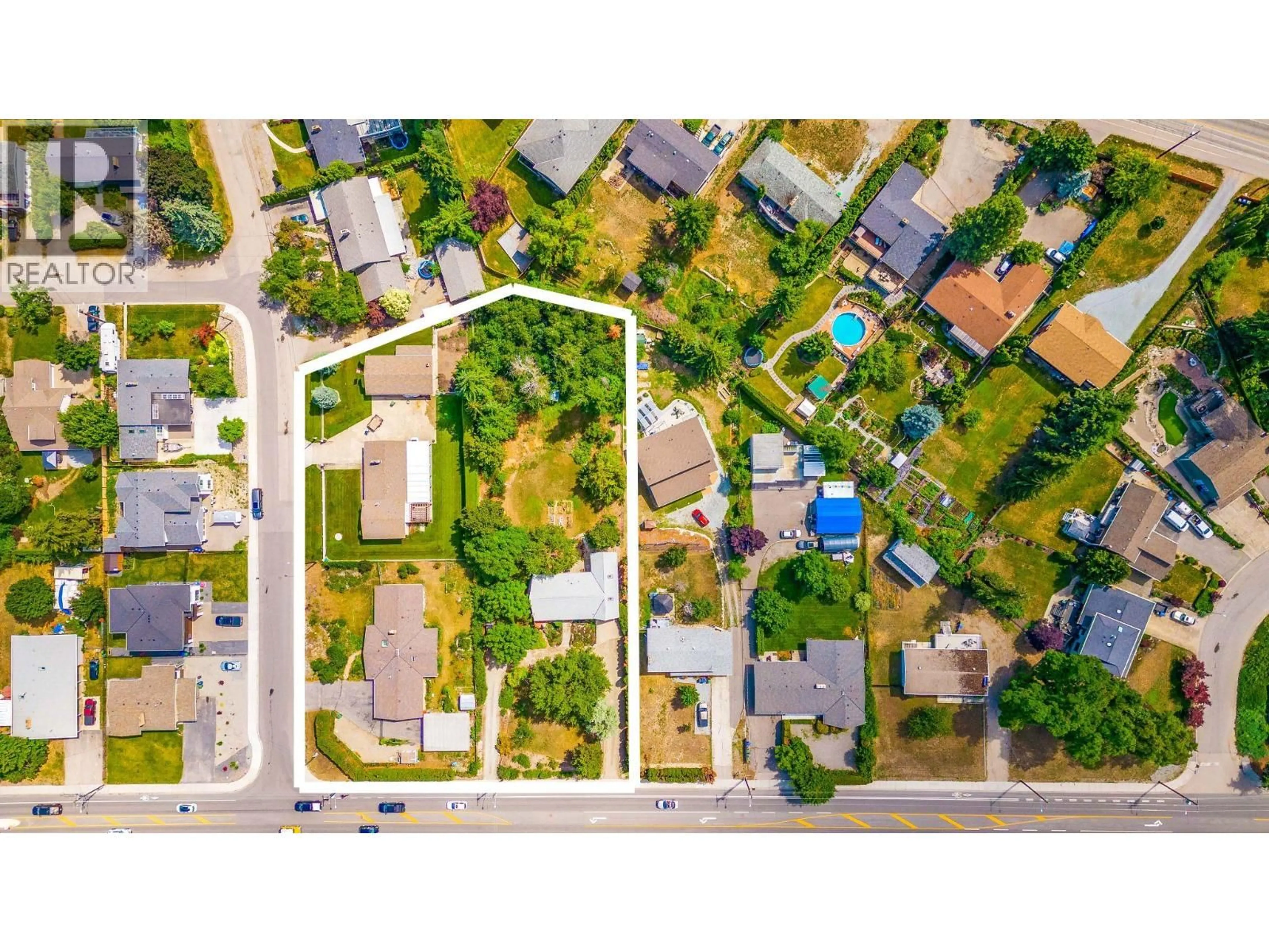A pic from outside/outdoor area/front of a property/back of a property/a pic from drone, street for 709 HAZELL ROAD, Kelowna British Columbia V1W1R2