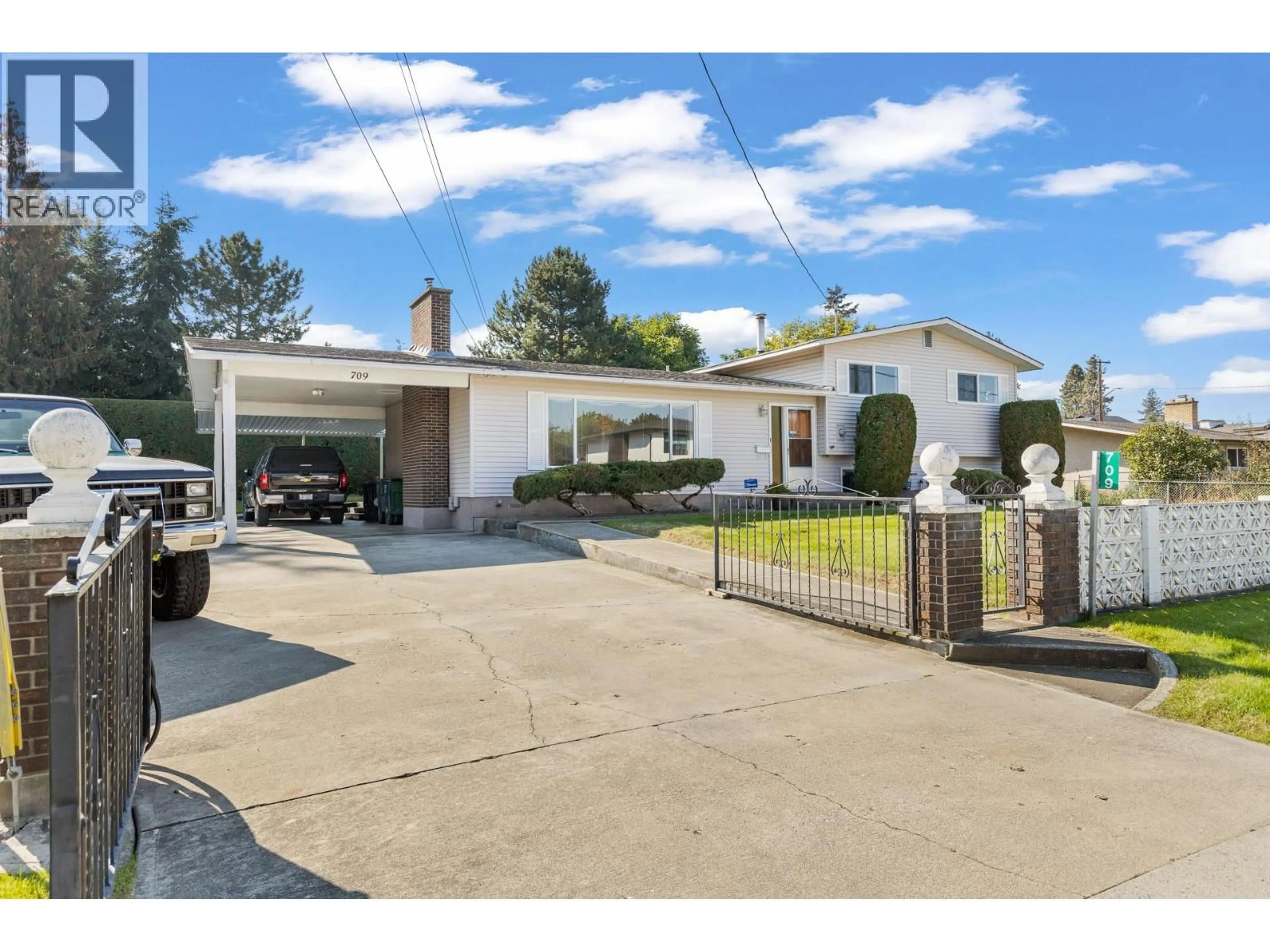 A pic from outside/outdoor area/front of a property/back of a property/a pic from drone, street for 709 HAZELL ROAD, Kelowna British Columbia V1W1R2