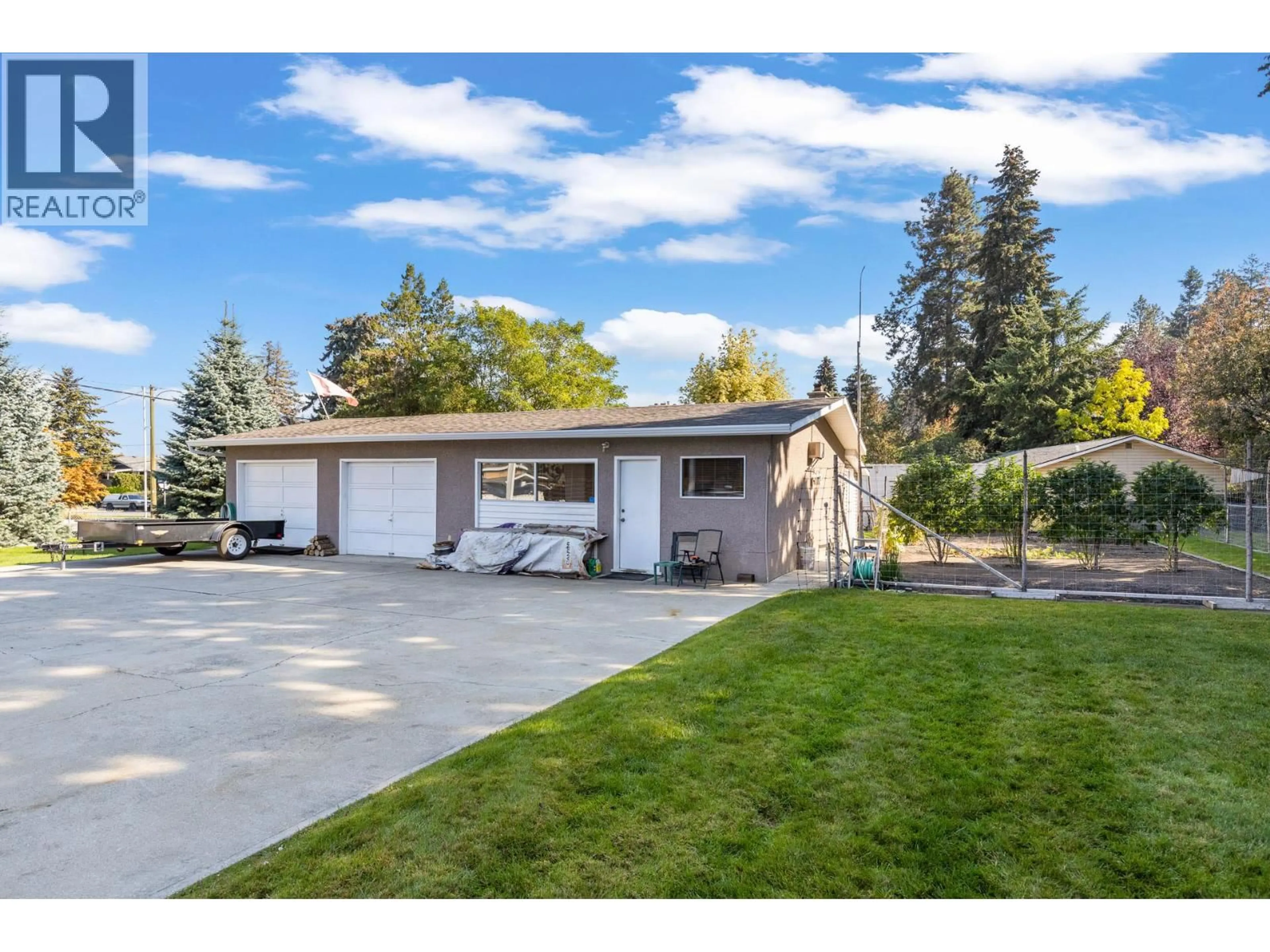 Home with vinyl exterior material, street for 709 HAZELL ROAD, Kelowna British Columbia V1W1R2